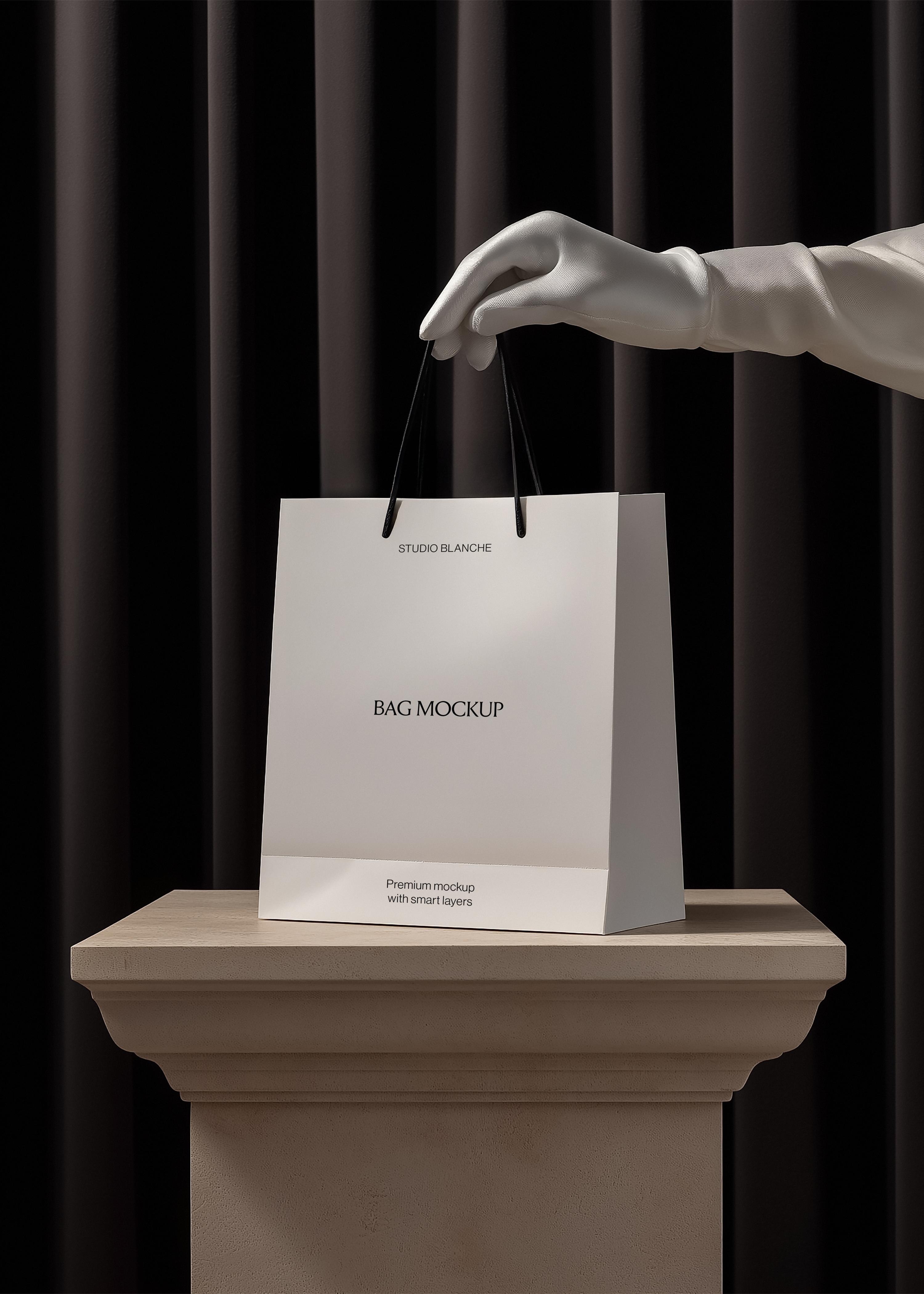 Luxury shopping bag mockup on classical plinth with white gloved hand lifting handles, minimal monochrome styling, dark curtain background