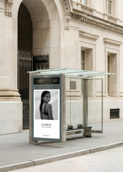 Bus shelter billboard mockup with luxury fashion campaign on a New York city street, from Studio Blanche