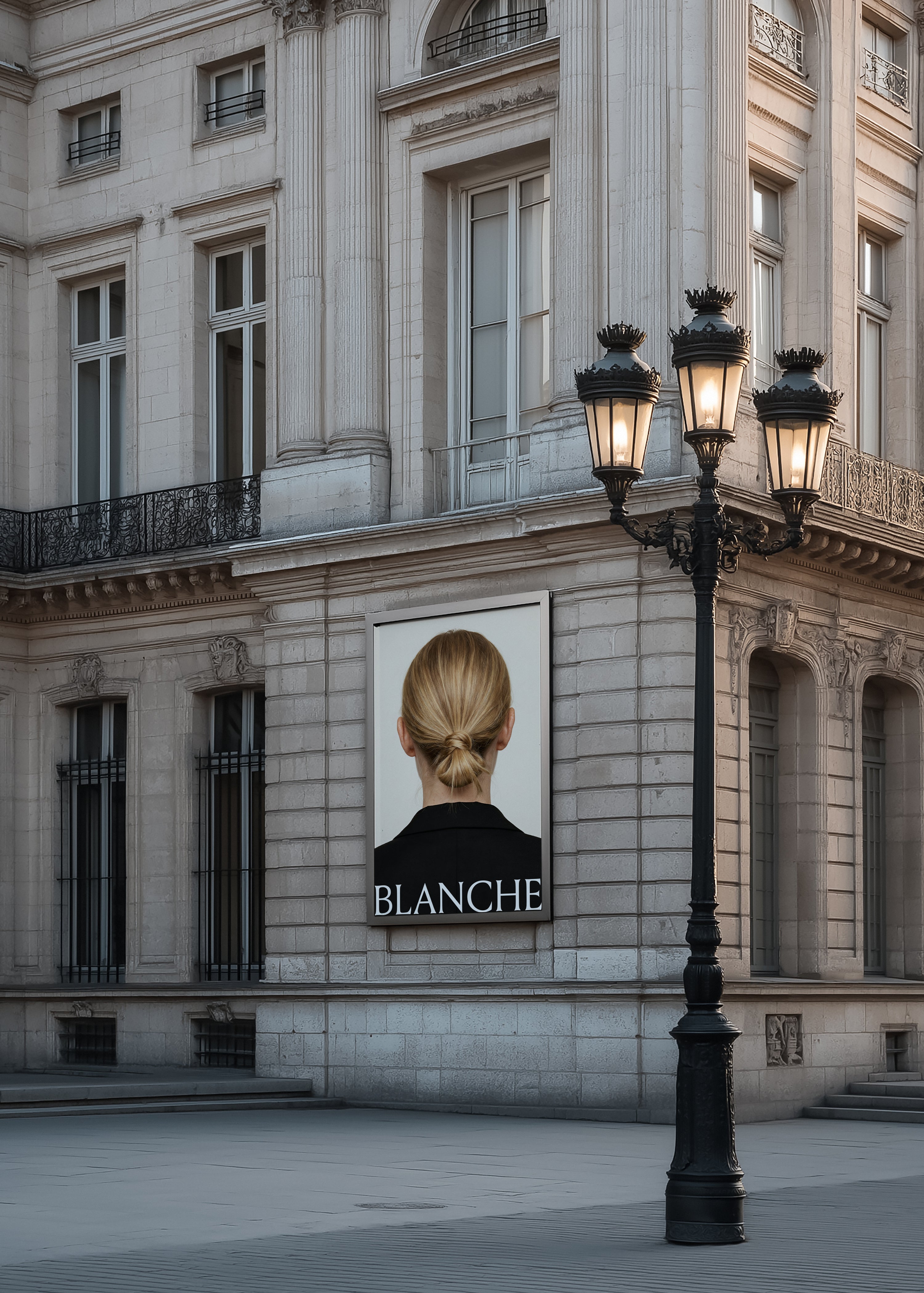 Billboard mockup on a Haussmann corner facade at dusk beside an ornate lamp post, displaying fashion campaign