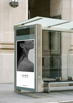Bus shelter billboard mockup with luxury beauty campaign on New York pavement, from Studio Blanche