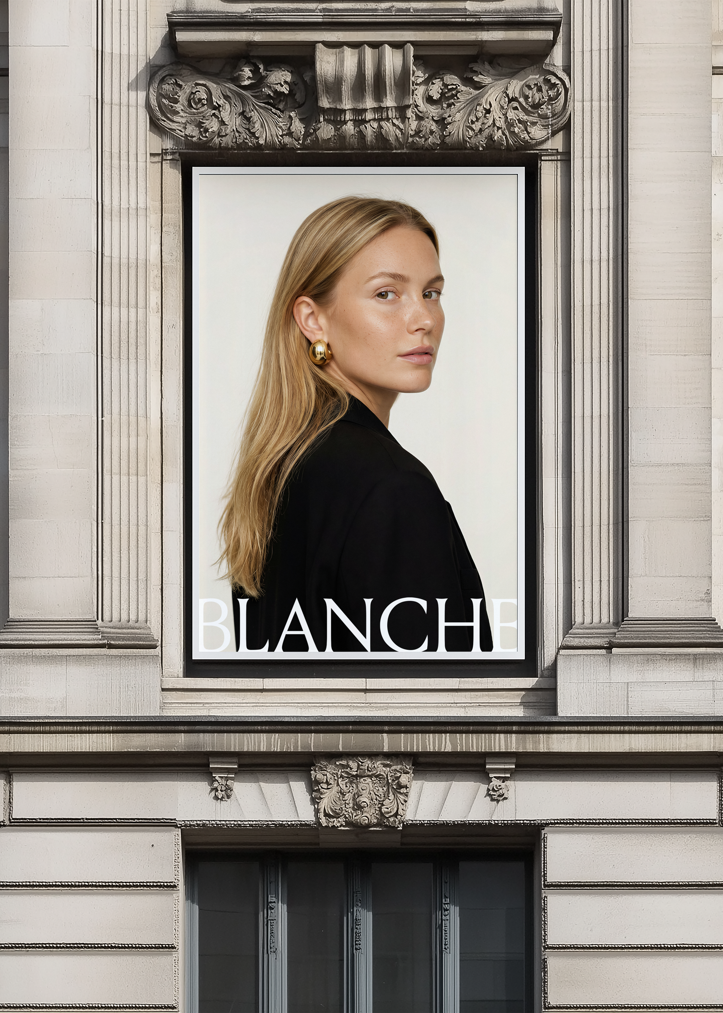 Black framed billboard mockup set into ornate stone facade above grand entrance, displaying fashion campaign artwork