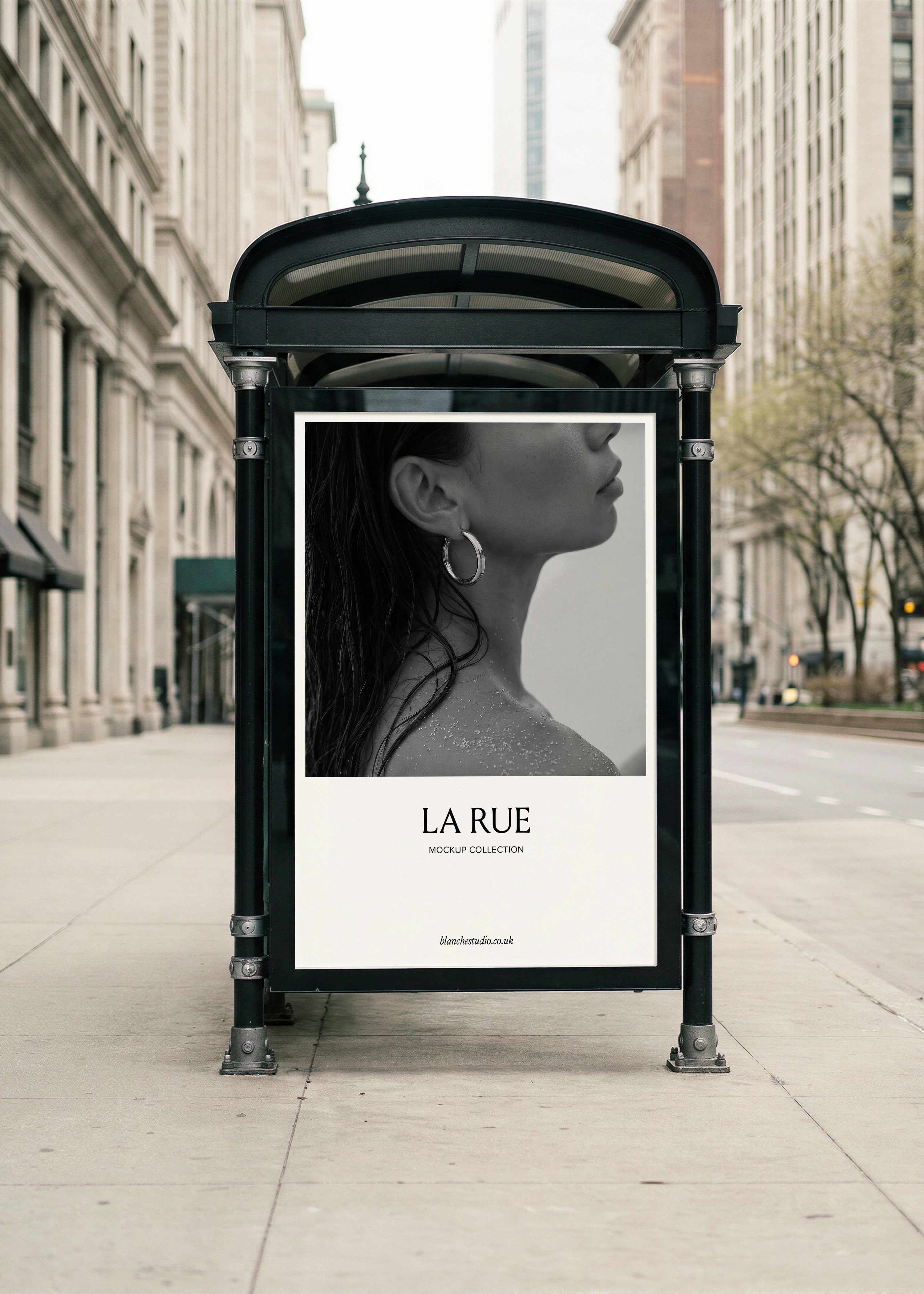 Billboard poster mockup displayed in ornate black iron bus stop shelter on city pavement with classical stone buildings