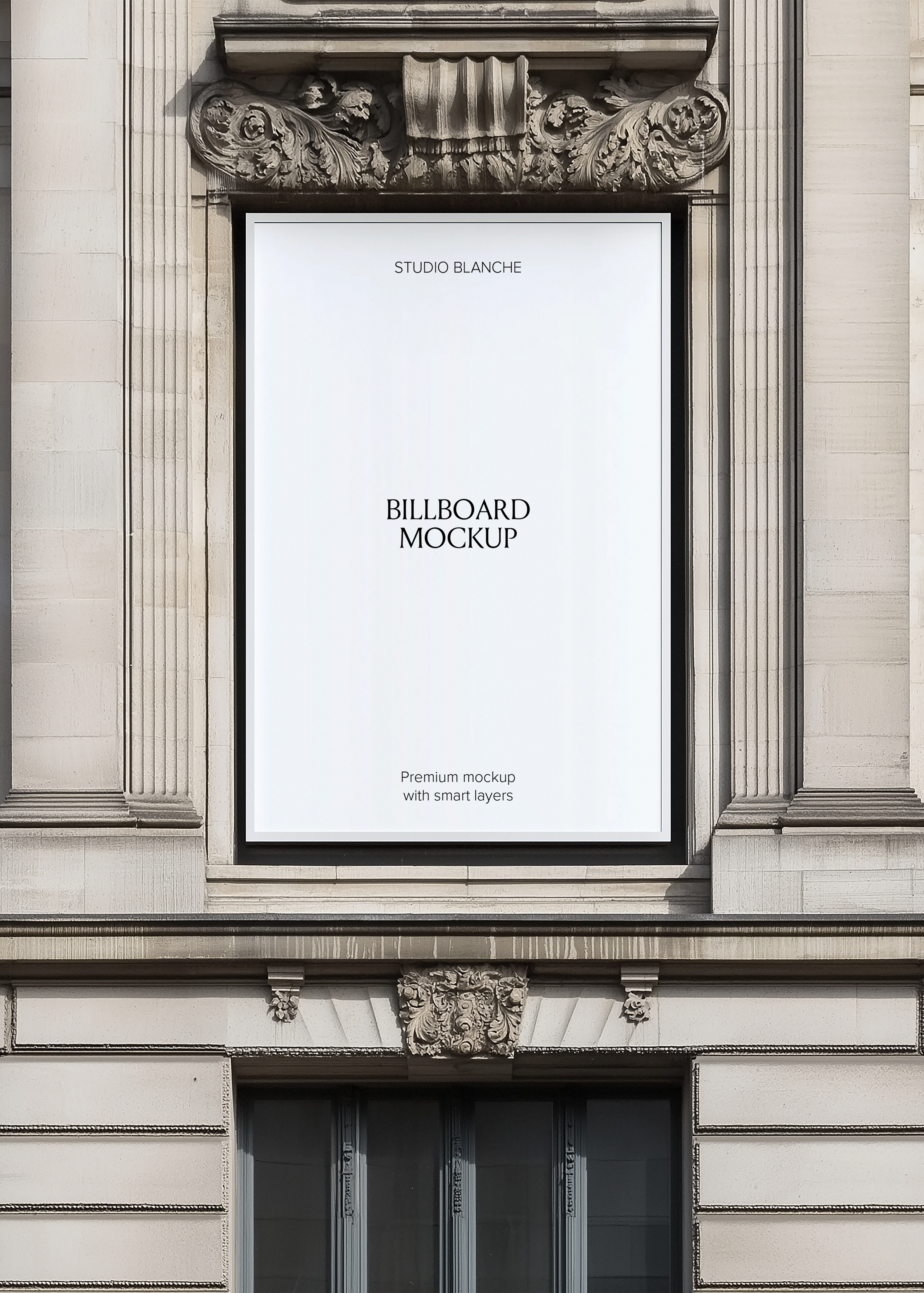 Blank black framed billboard mockup on ornate European stone facade, empty white panel with Studio Blanche label