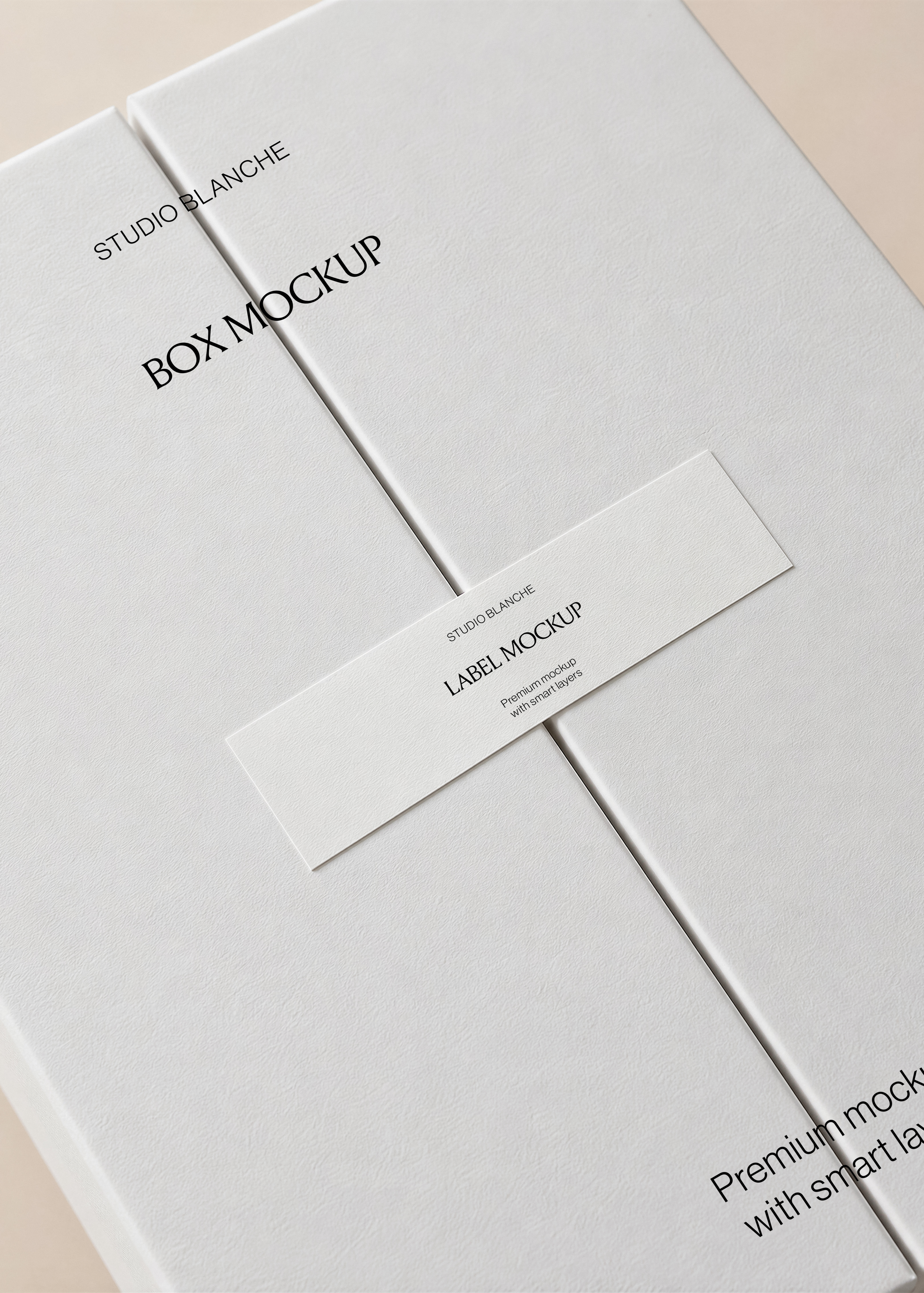 Box and label mockup close-up showing a white paper label strip over the centre seam of a textured neutral gatefold box