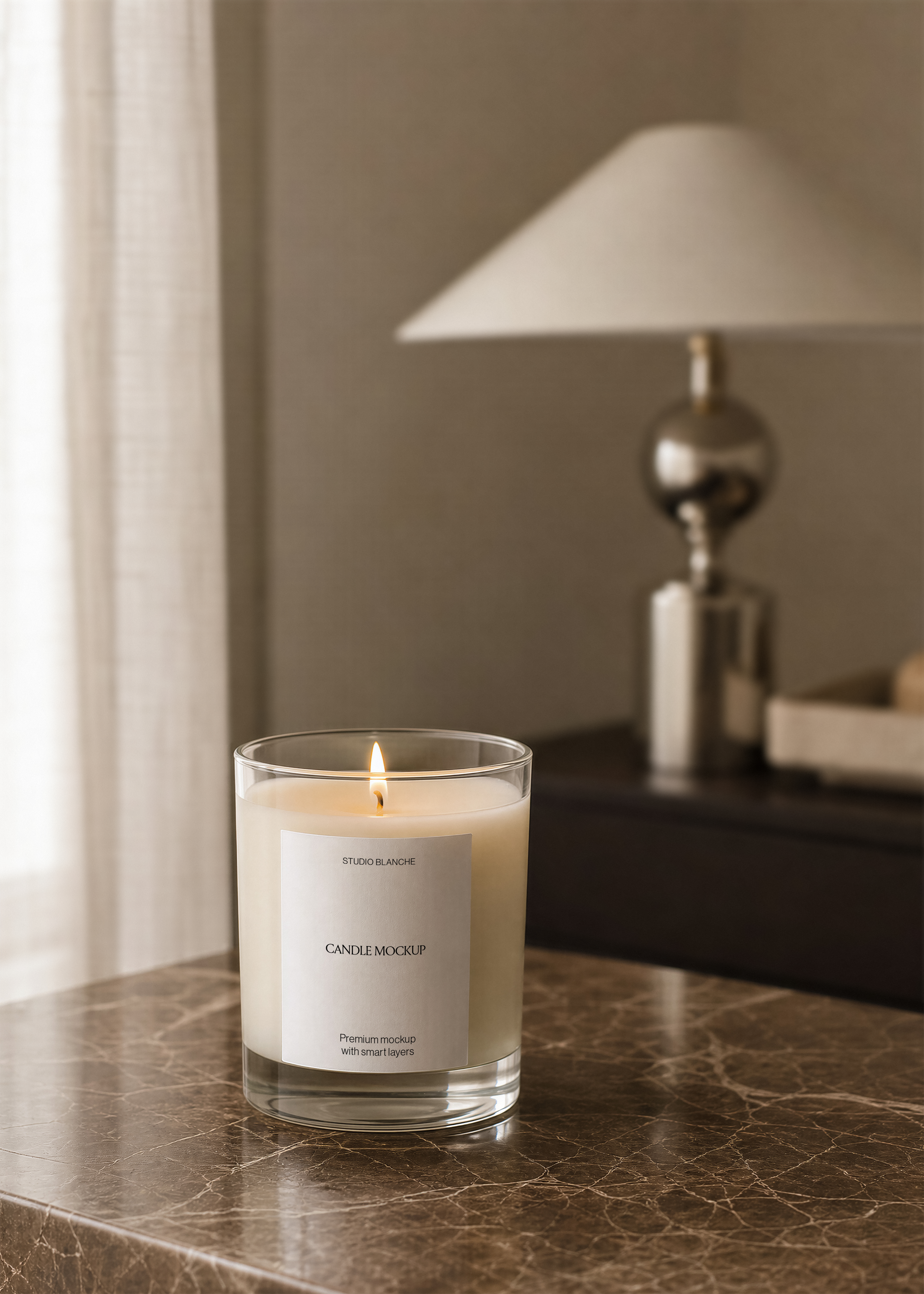 Glass candle jar mockup with minimal white label and scent name, close view on veined marble tabletop