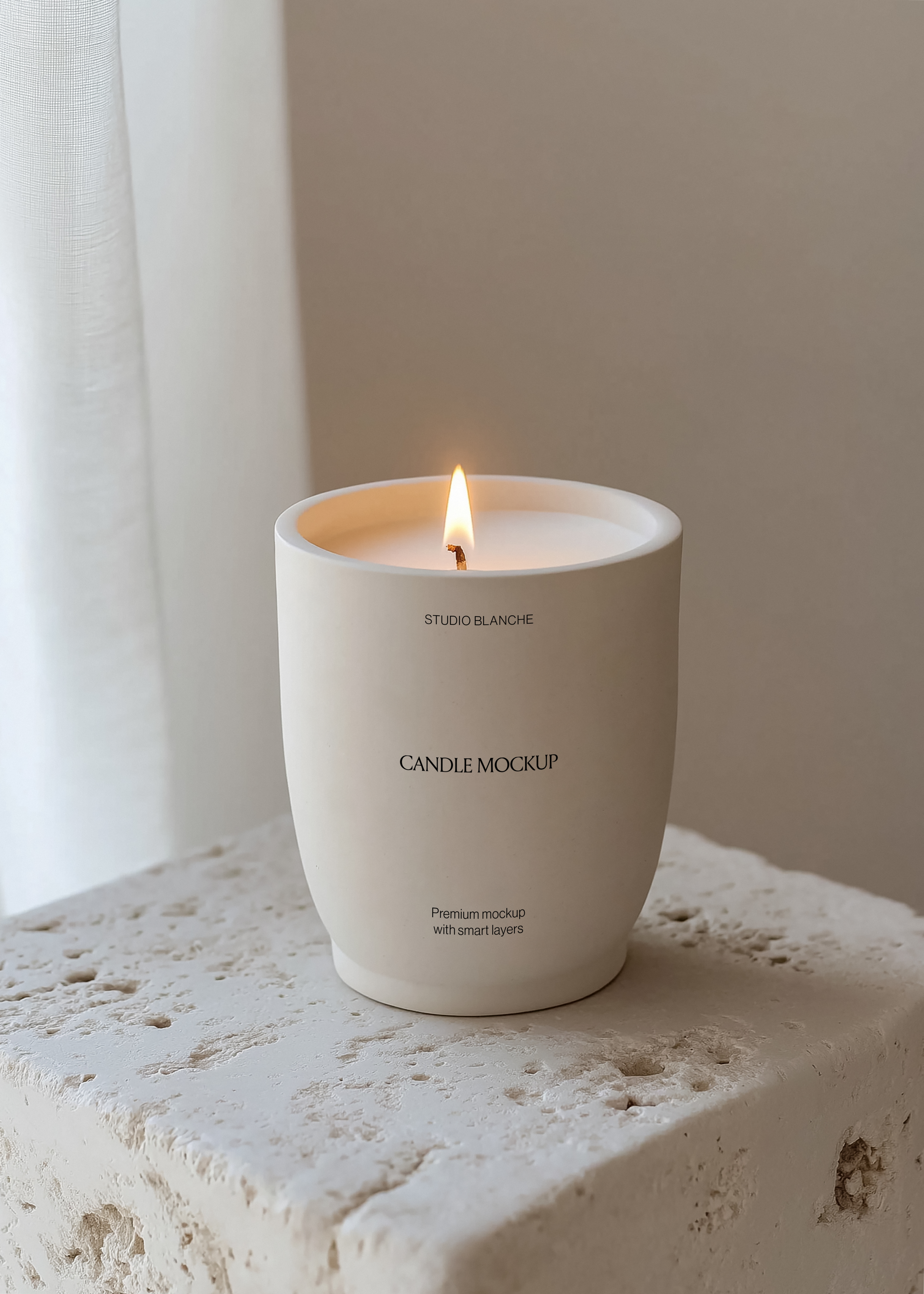 Studio Blanche ceramic candle mockup on stone ledge beside sheer linen curtain, warm flame, minimal interior scene