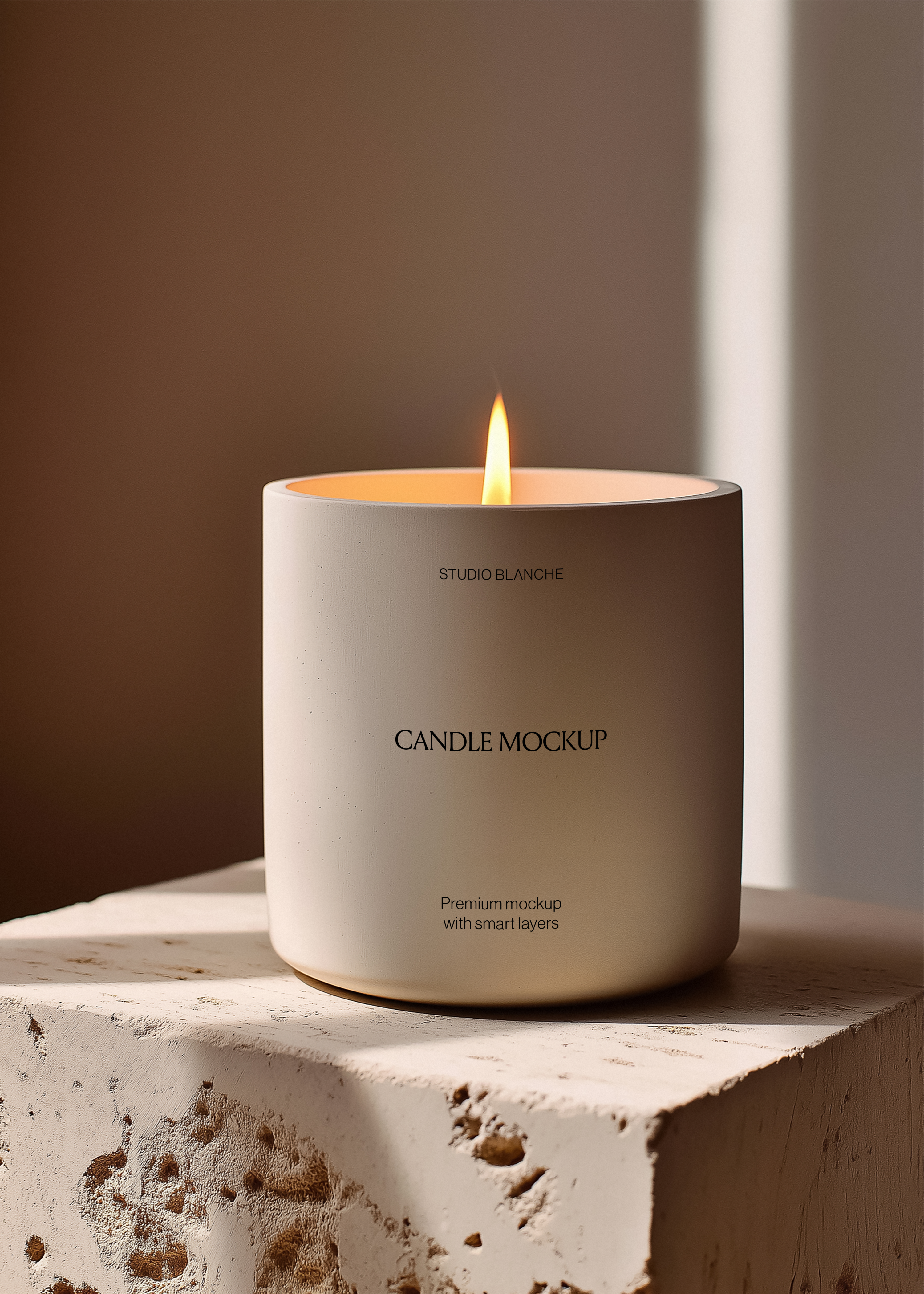 Studio Blanche concrete candle mockup, warm terracotta background, stone block plinth, dramatic side light, lit flame