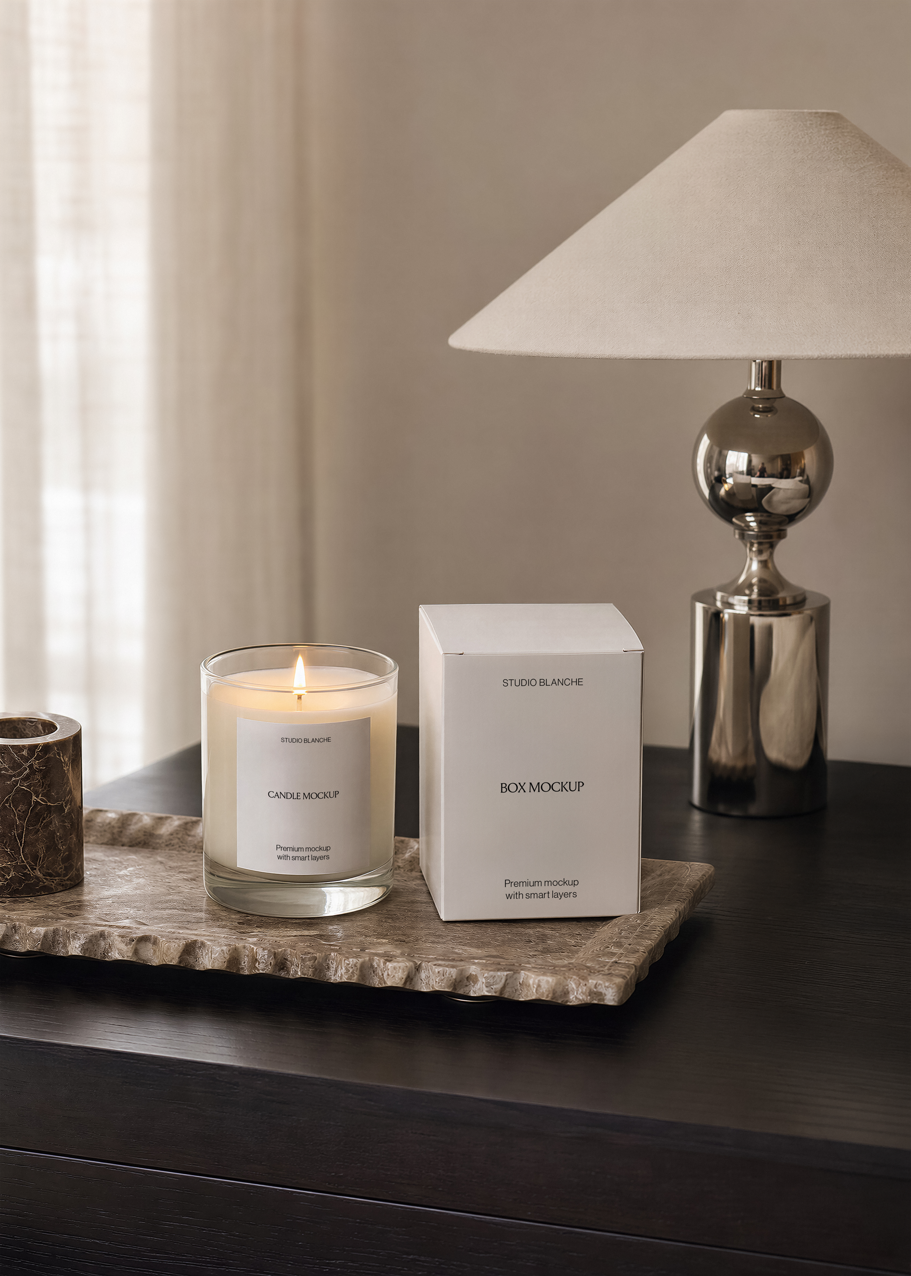 Glass candle jar mockup with minimal label copy, standing on veined marble in a warm lamplit interior
