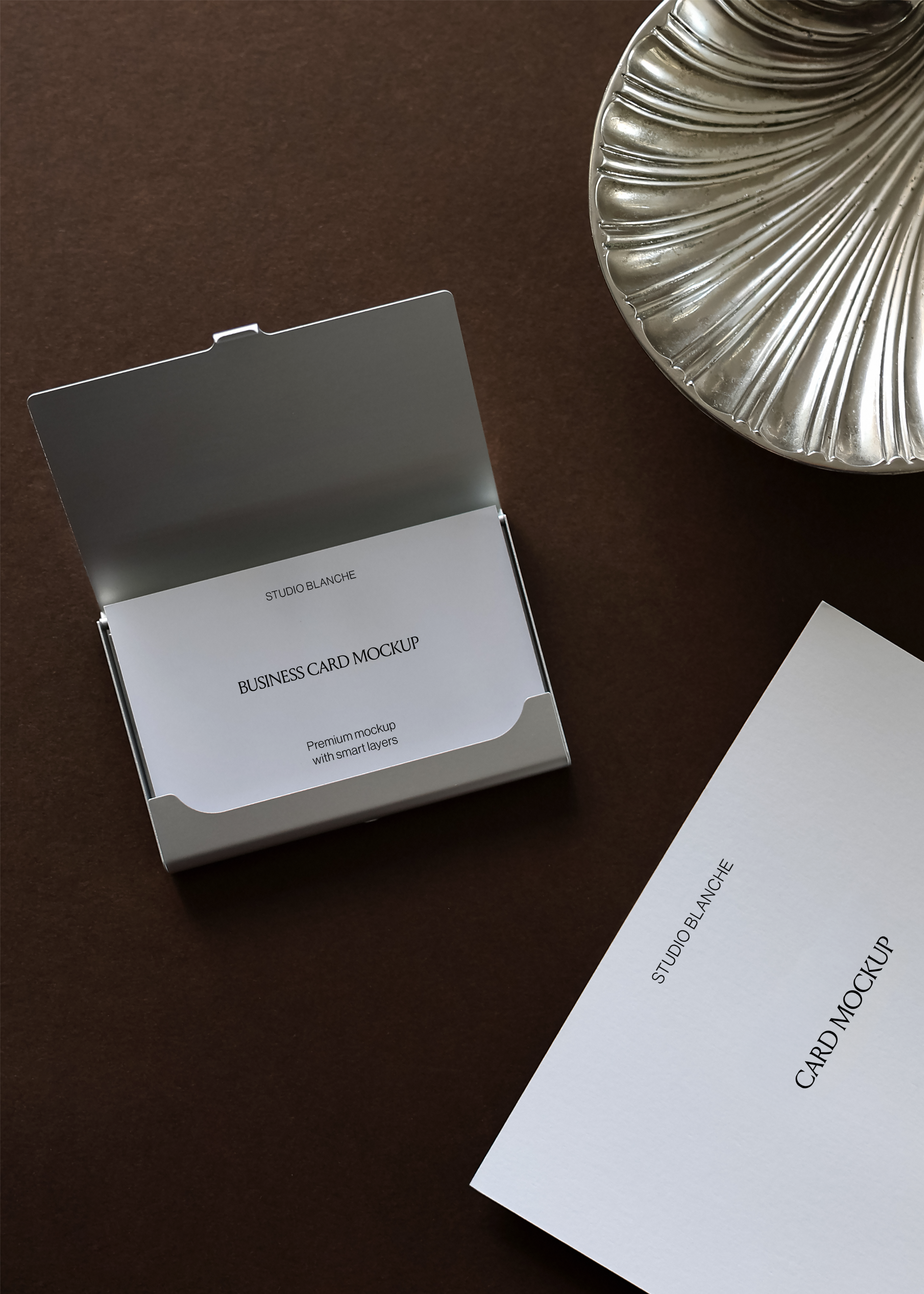 Business card holder mockup detail showing card inside case next to separate A6 card with floral imagery