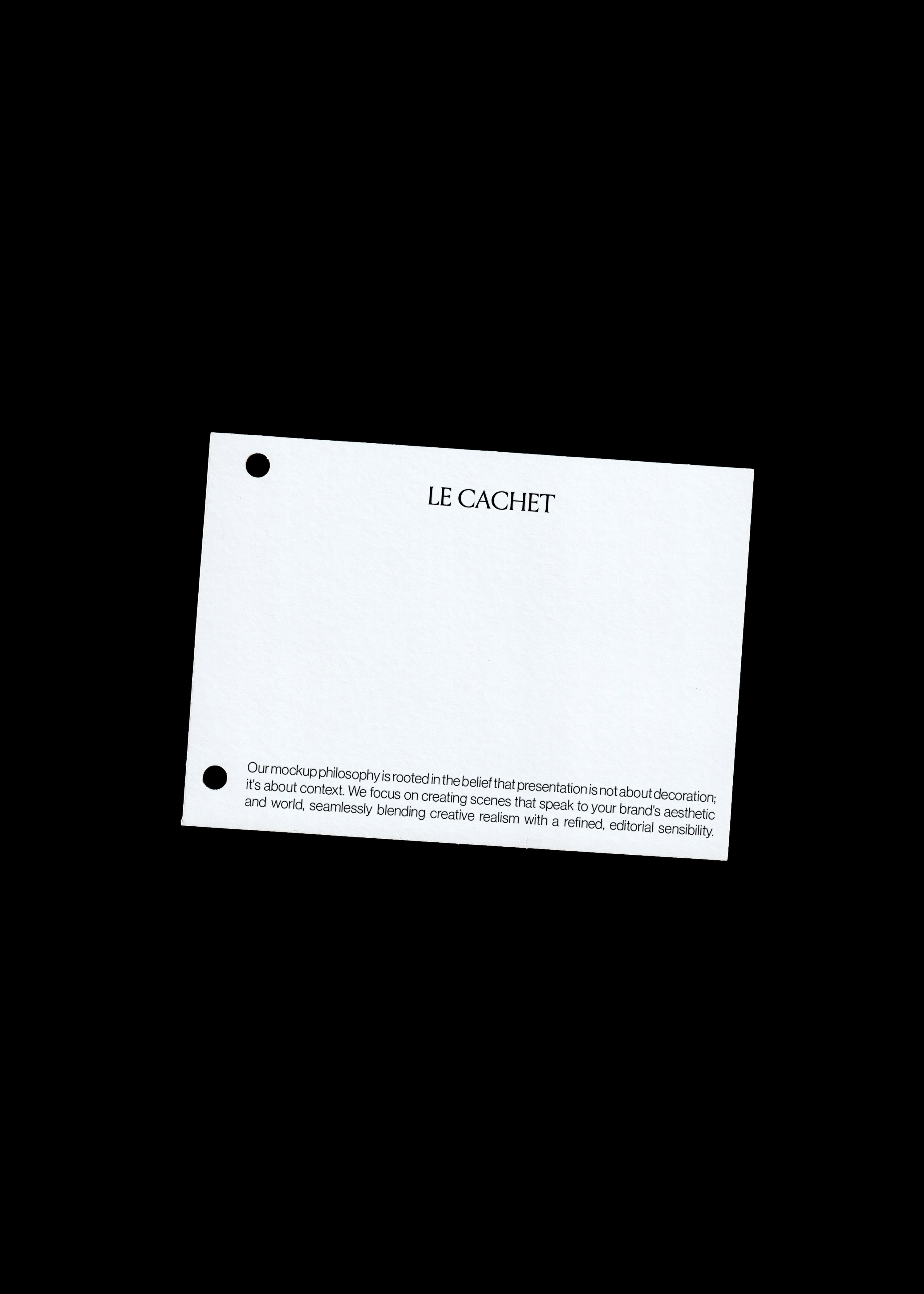 Punched card mockup on black, white textured card tilted with two round punch holes on the left edge
