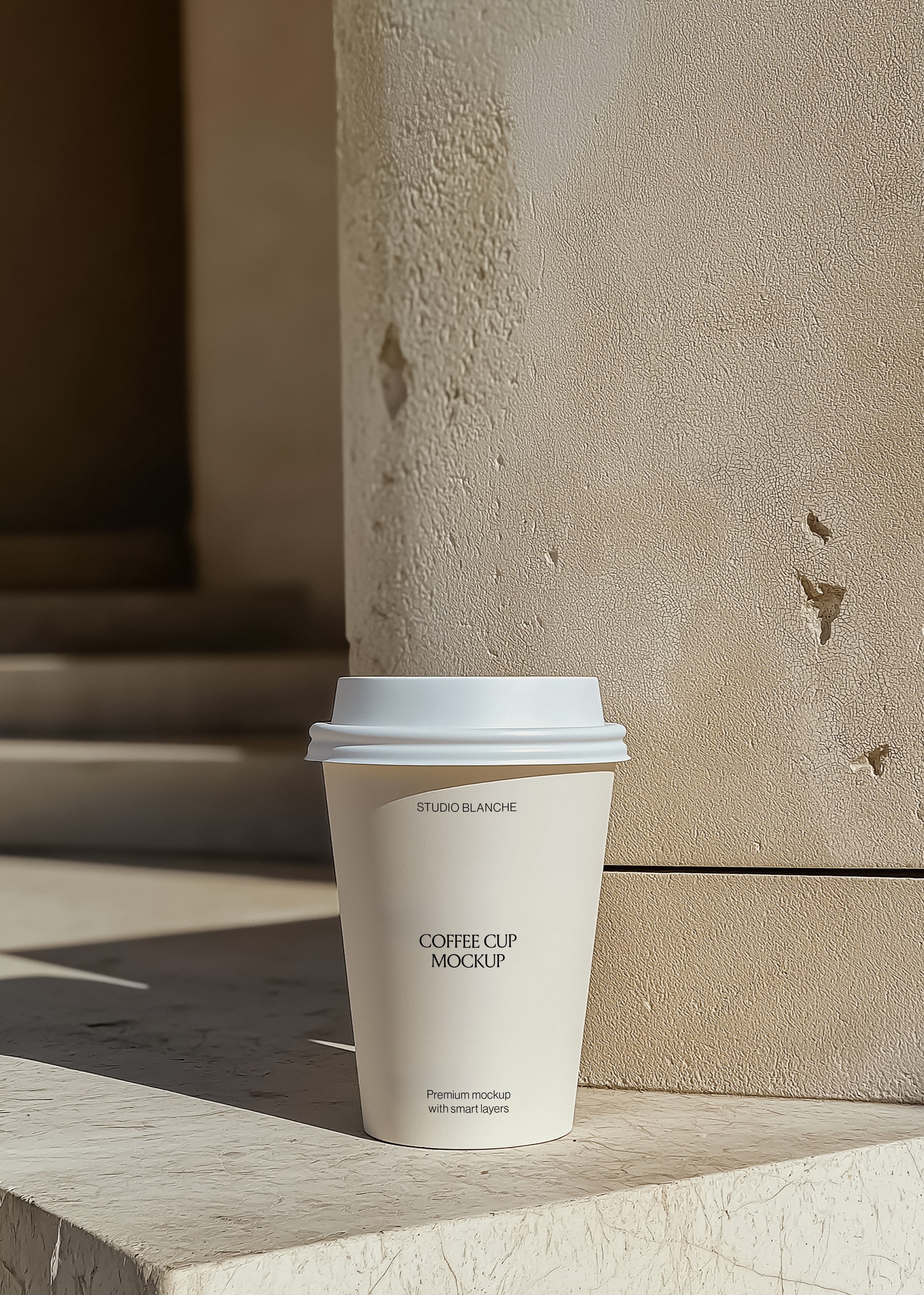 Coffee cup mockup showing centred café label text, cream paper cup and lid, beige plaster wall behind, hard shadows