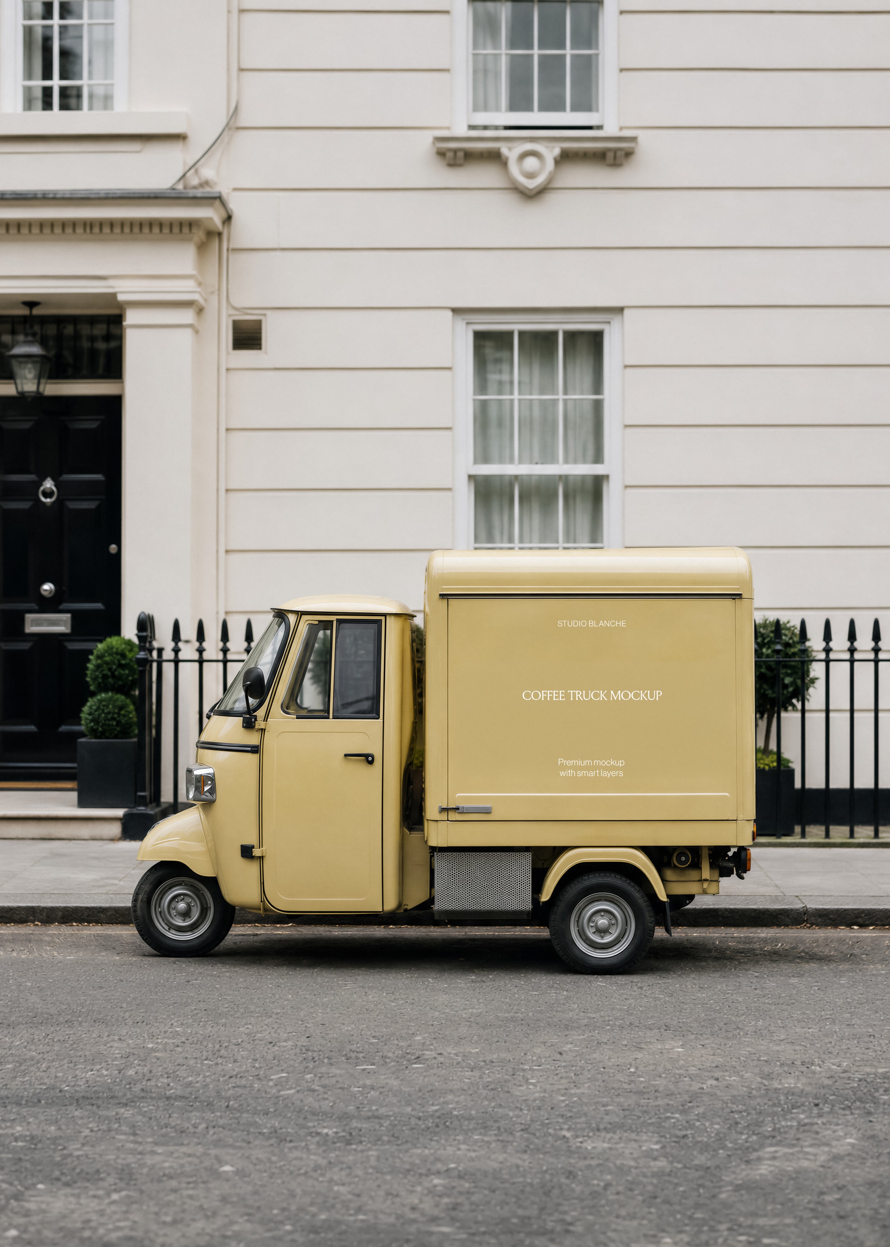 Cream coffee truck mockup with STUDIO BLANCHE wordmark and COFFEE TRUCK MOCKUP text on side panel, same street setting