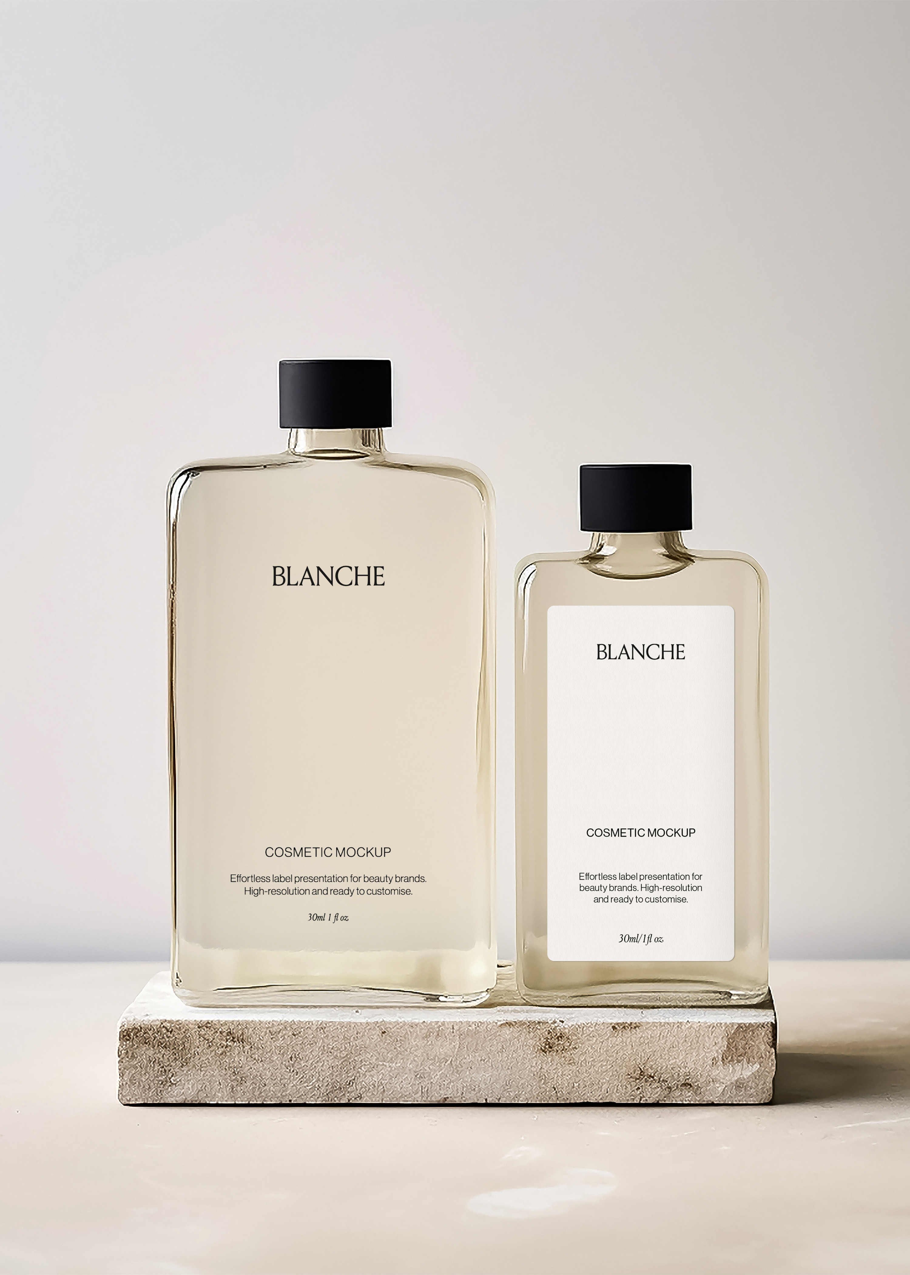 Two flat flask cosmetic bottle mockups with black caps and amber liquid on a travertine slab, warm neutral backdrop