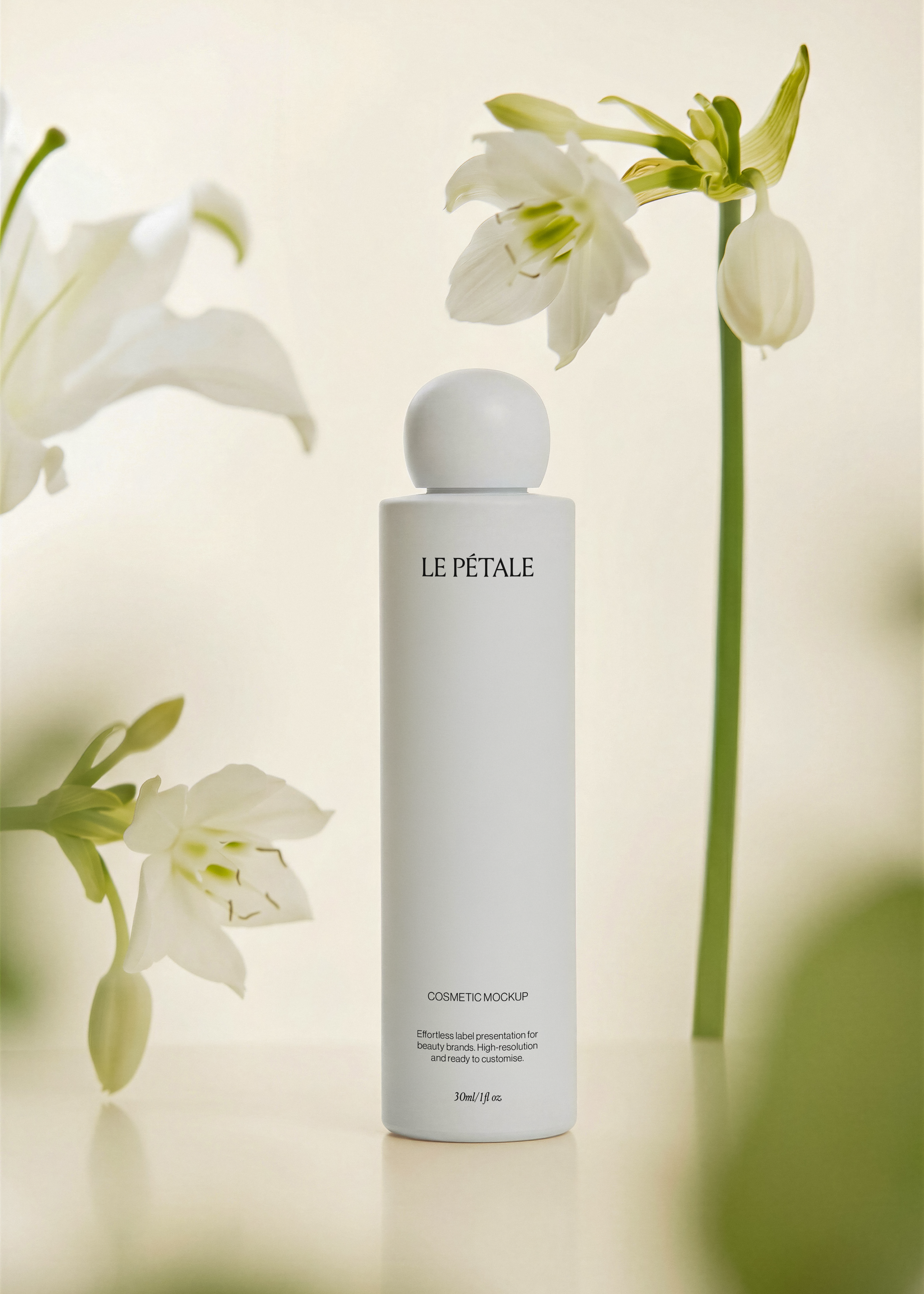 Tall matte cosmetic bottle mockup with ball cap and printed label, white amaryllis blooms surrounding, soft celadon backdrop