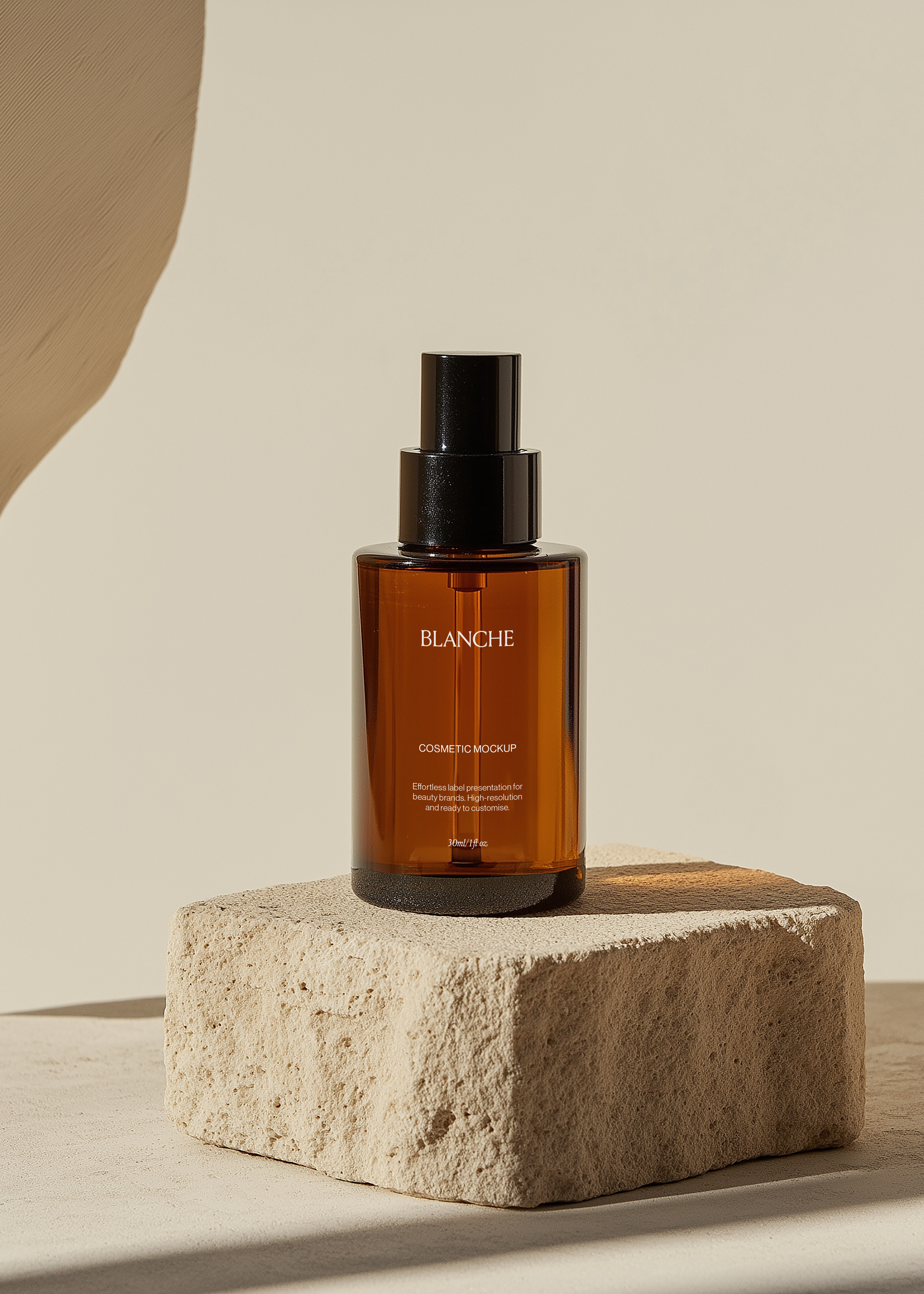 Amber glass cosmetic pump bottle mockup with black spray pump on a raw limestone block in warm sunlight