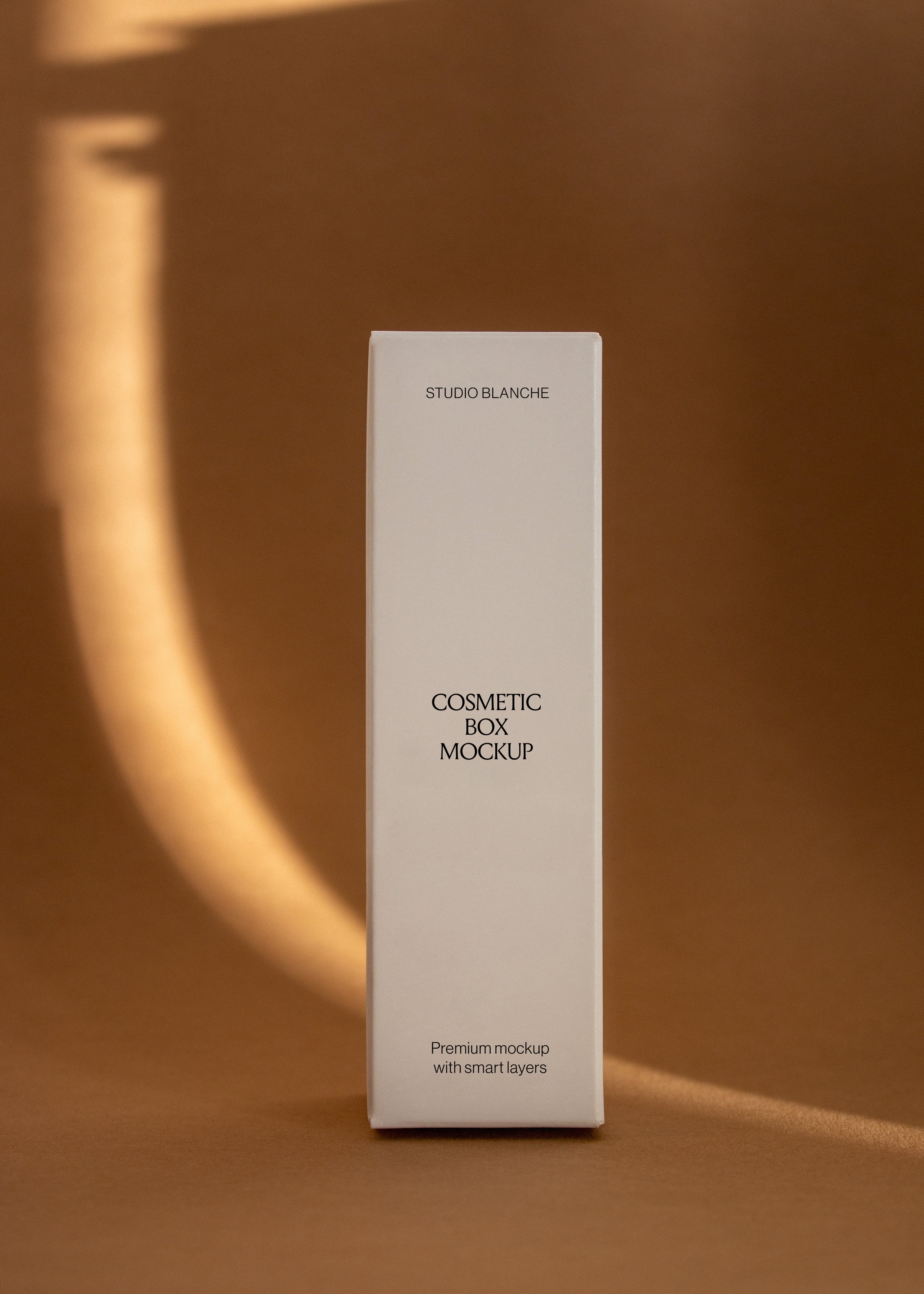 Slim white cosmetic carton box mockup with black label text on warm brown backdrop lit by a soft curved beam