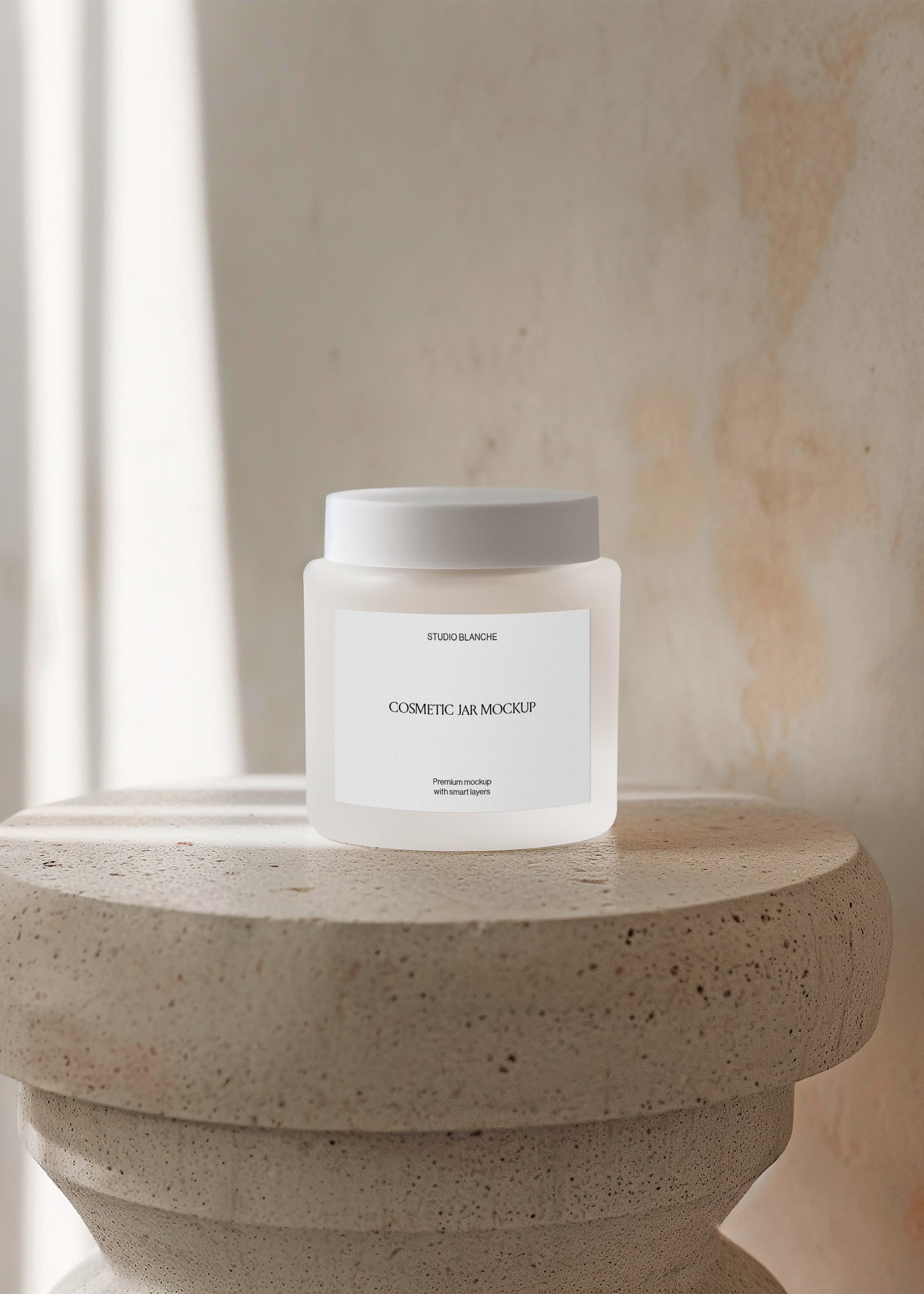 Frosted cosmetic jar mockup on tiered stone column pedestal in warm window light, minimal editorial scene