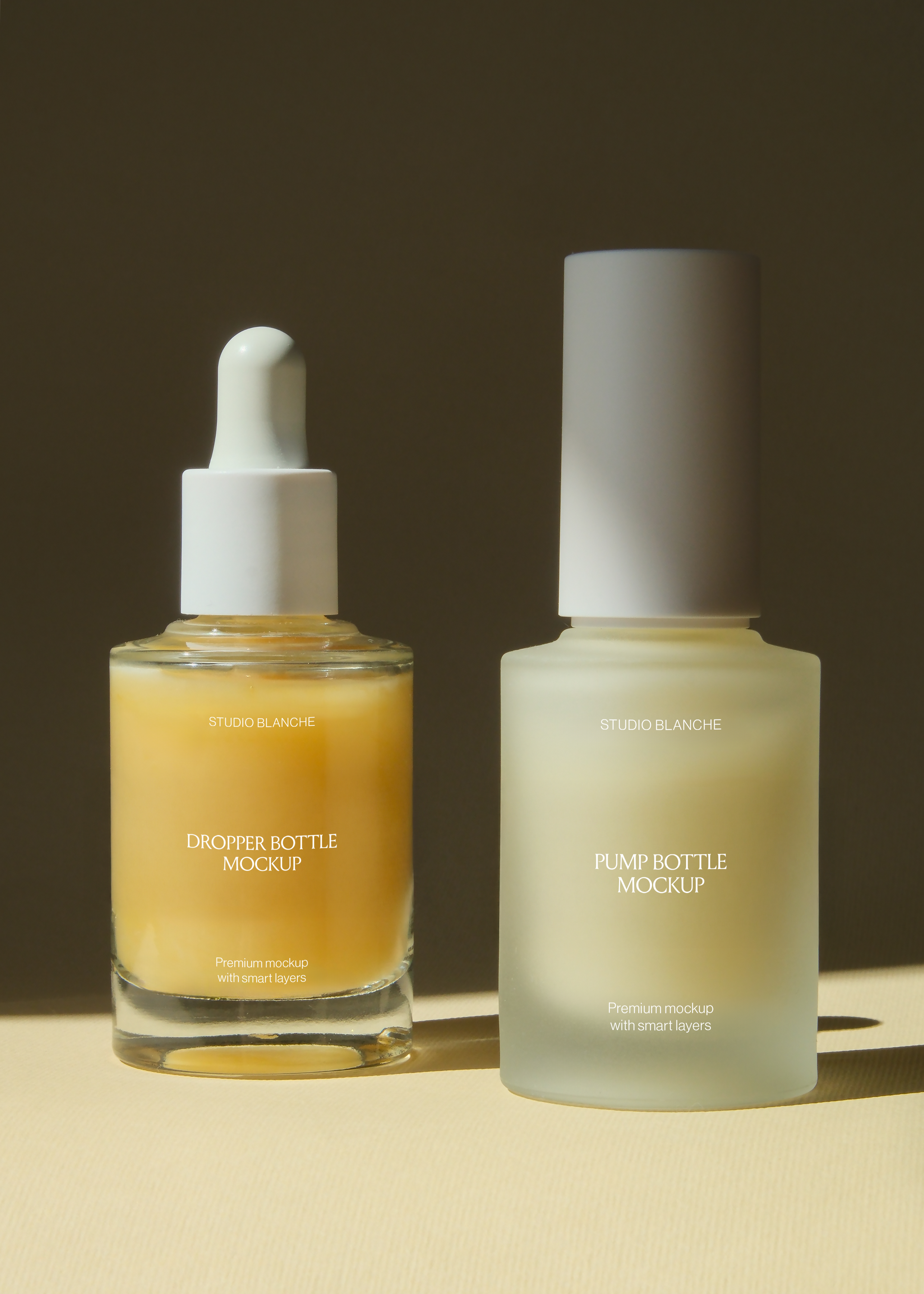 Pump bottle and dropper bottle mockup pair, front facing, evenly spaced on tan surface with soft dark background