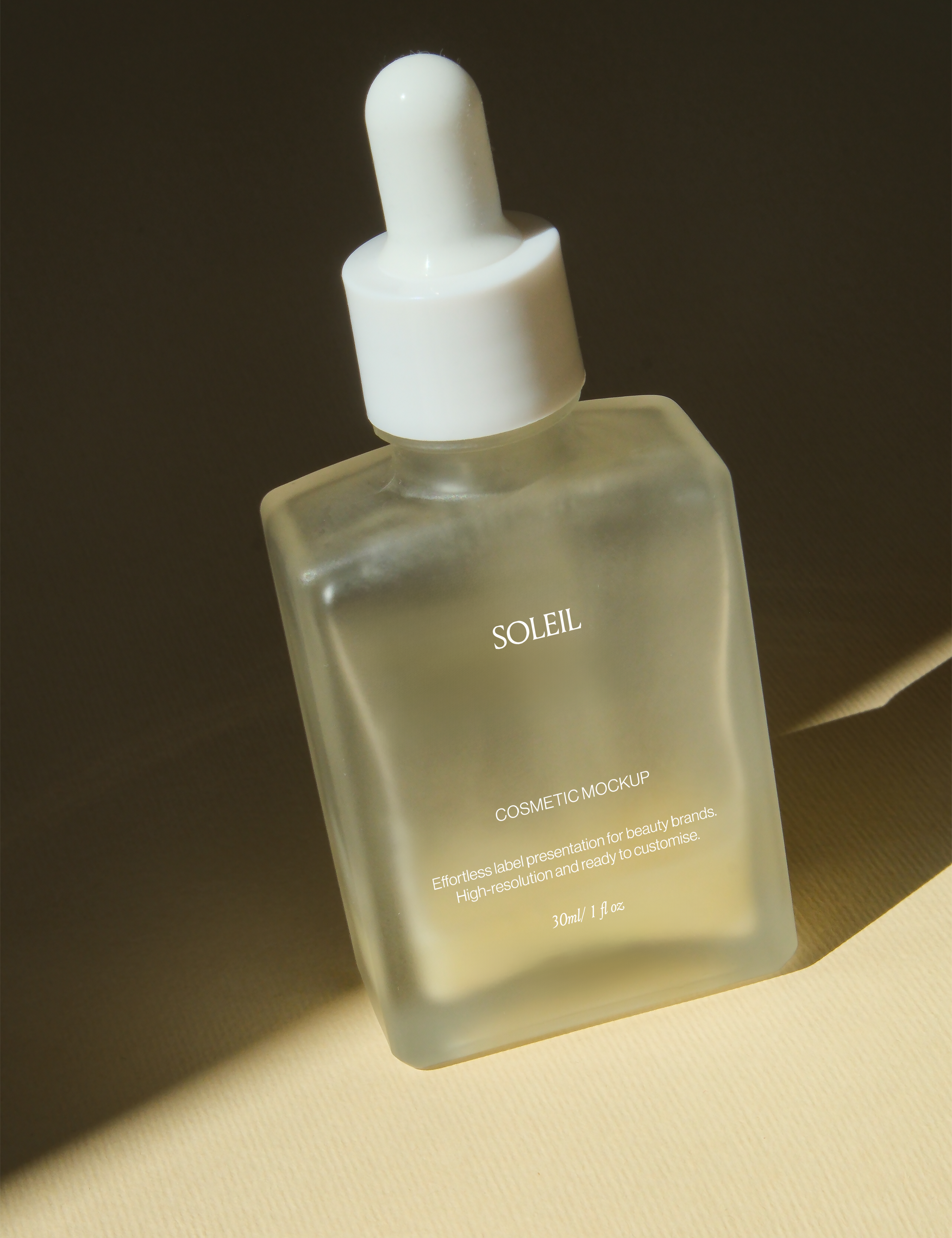 Frosted glass dropper bottle angled against dark backdrop with soft warm light along one edge, matte square silhouette