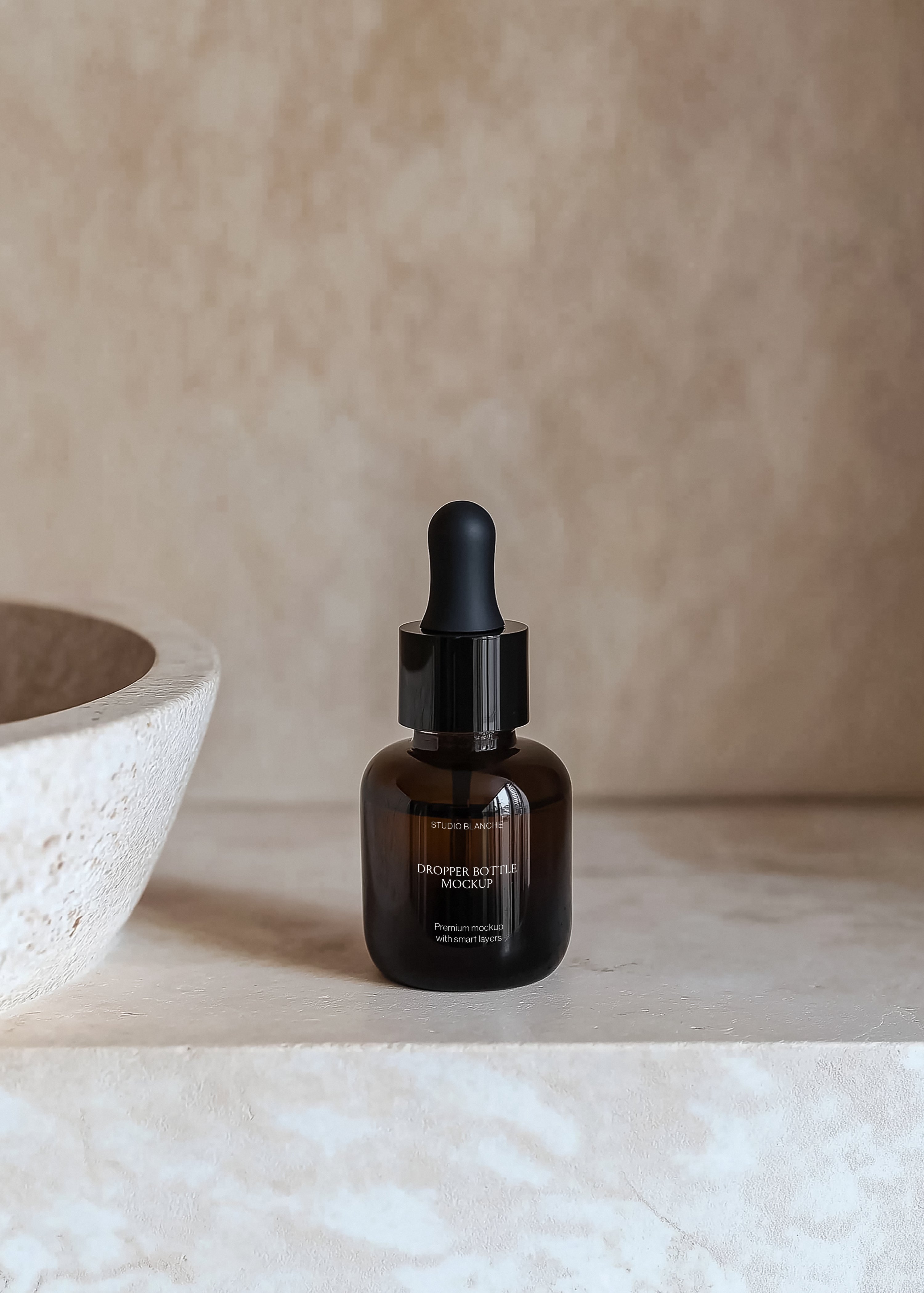 Serum dropper bottle mockup on travertine surface with textured stone bowl, soft warm light and shadow, minimal styling