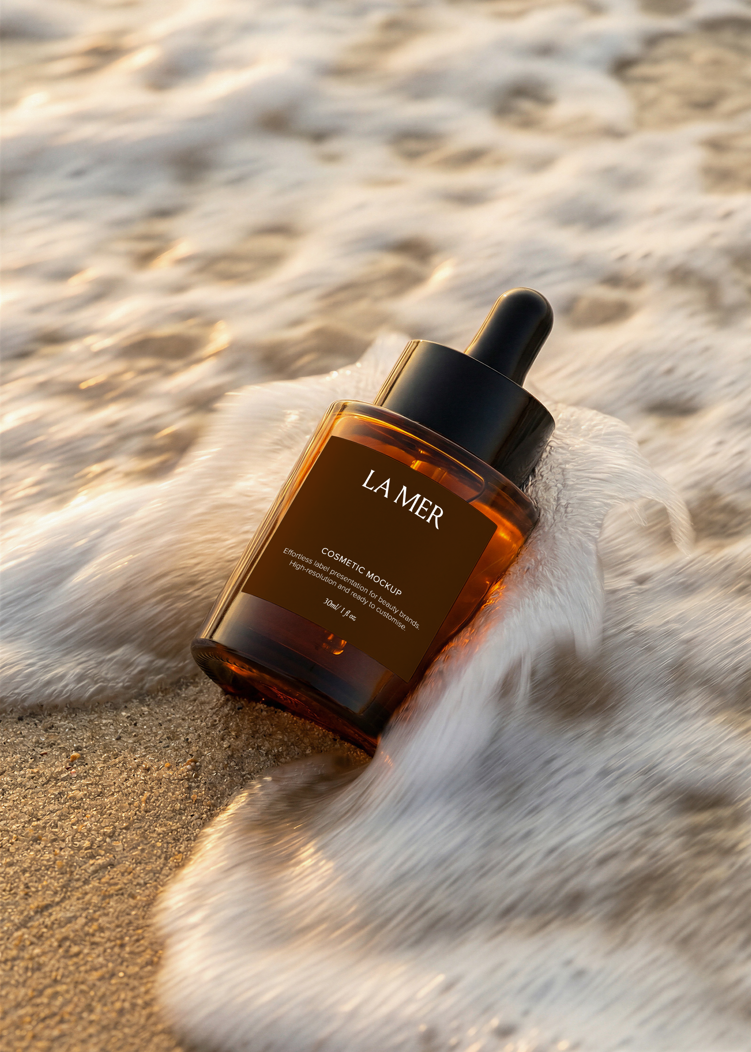 Amber dropper bottle mockup lying on wet sand as a wave of sea foam rushes over it, black pipette top, golden-hour light