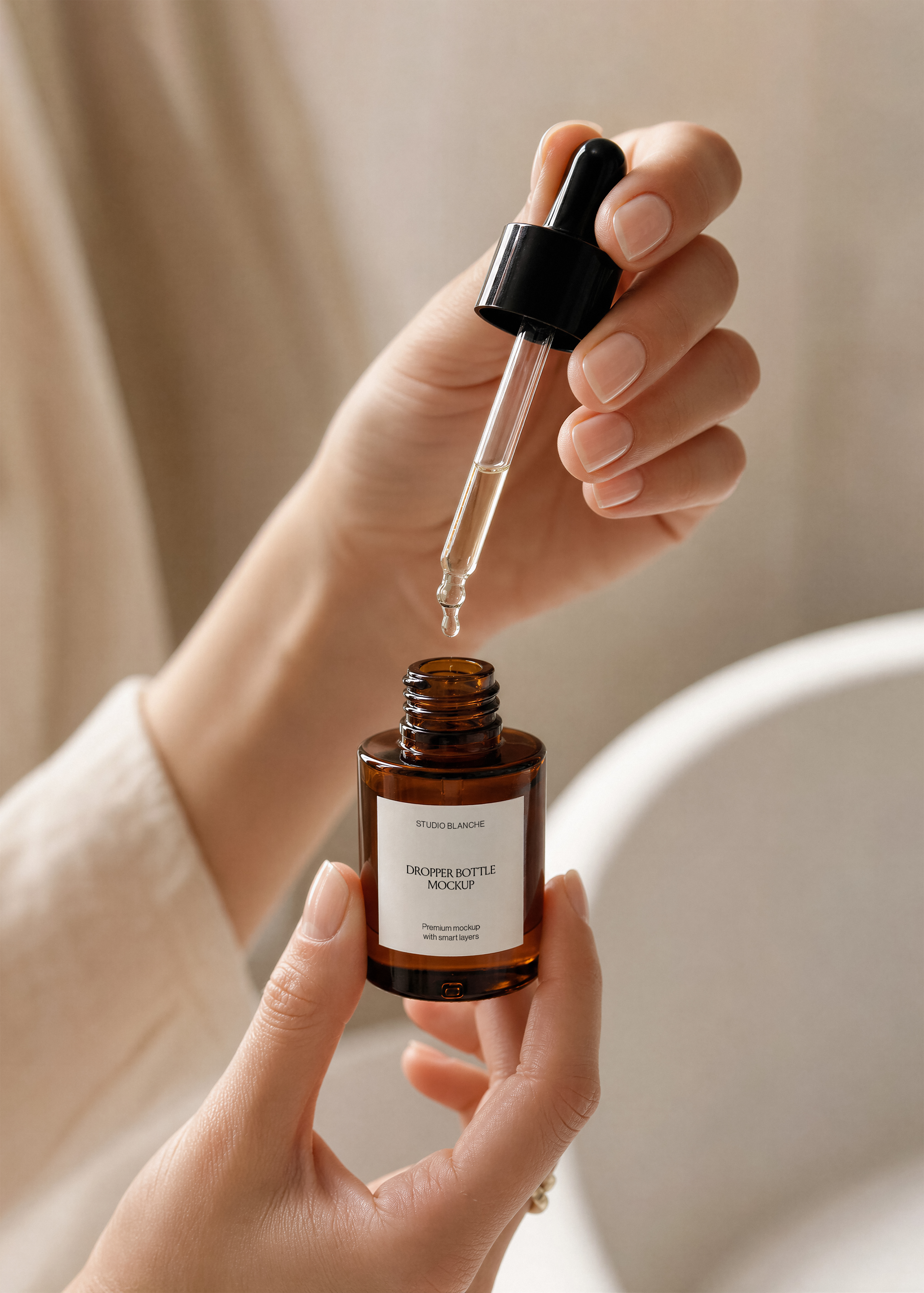 Close view of amber glass serum dropper bottle mockup with white label, black pipette dispensing an oil drop