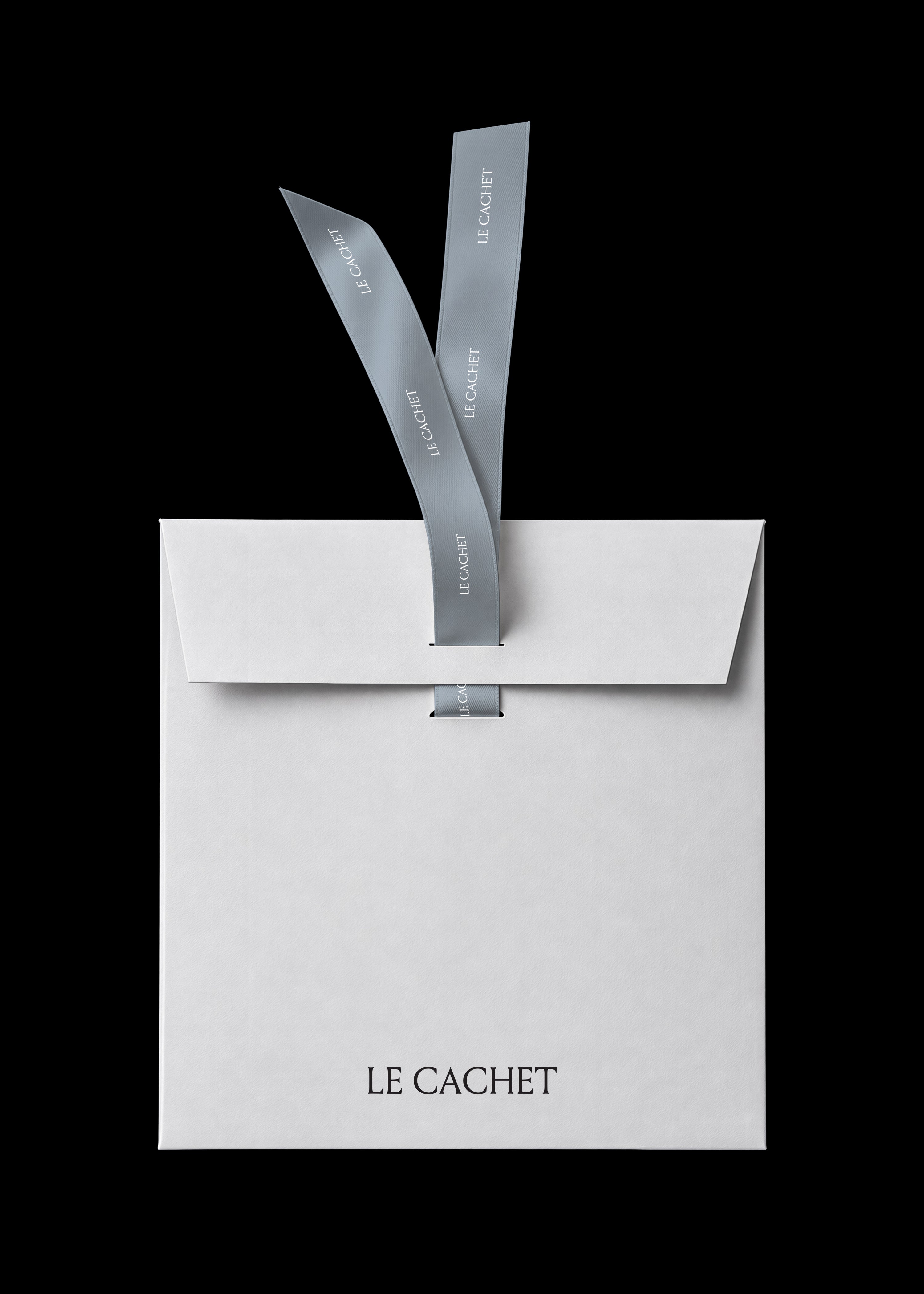 Paper envelope mockup in white with blue satin ribbon closure on a black background, minimal editorial styling