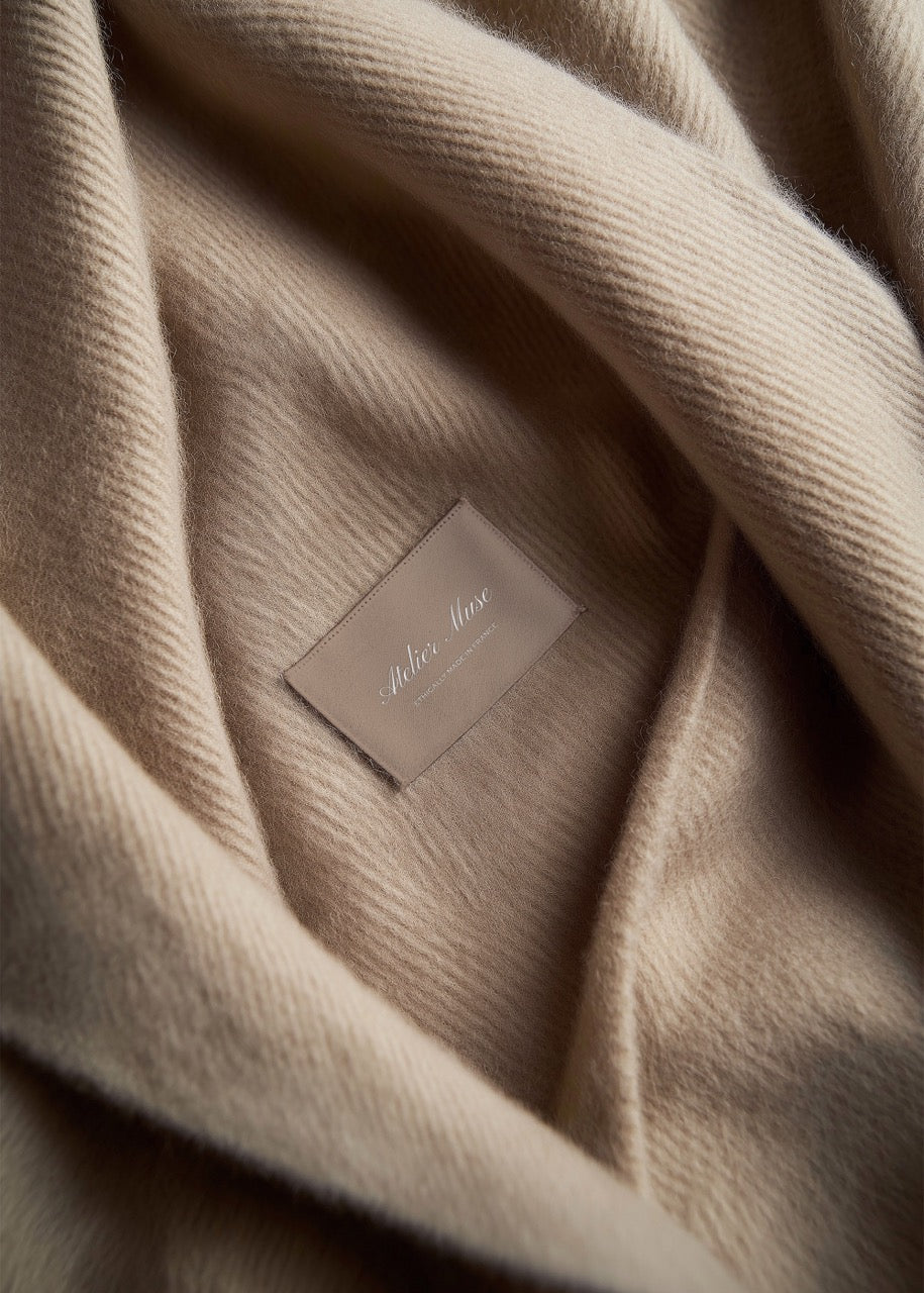 Beige fabric with a brand label in the center