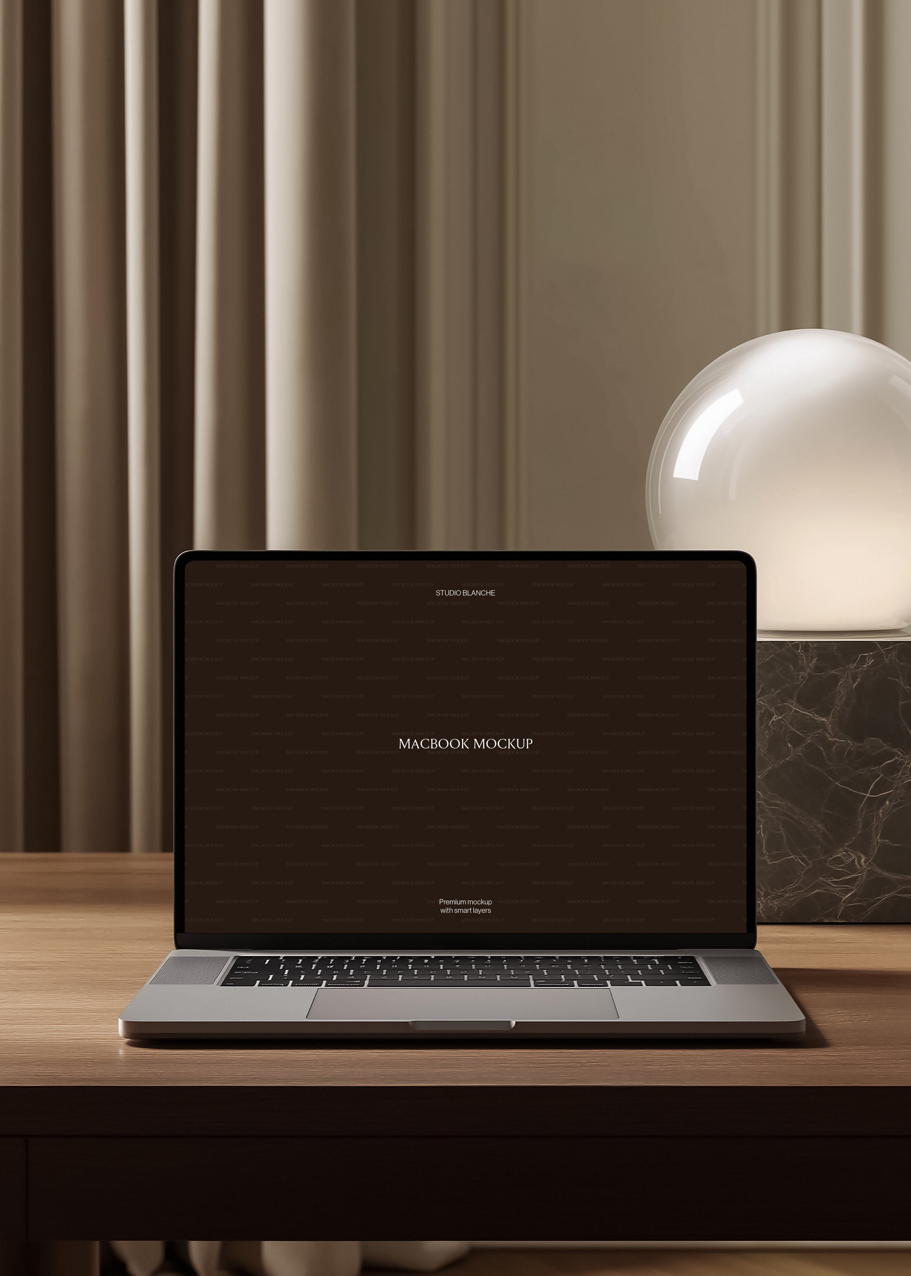 MacBook mockup on warm oak desk beside dark marble globe lamp, pleated curtains and moulded wall panelling