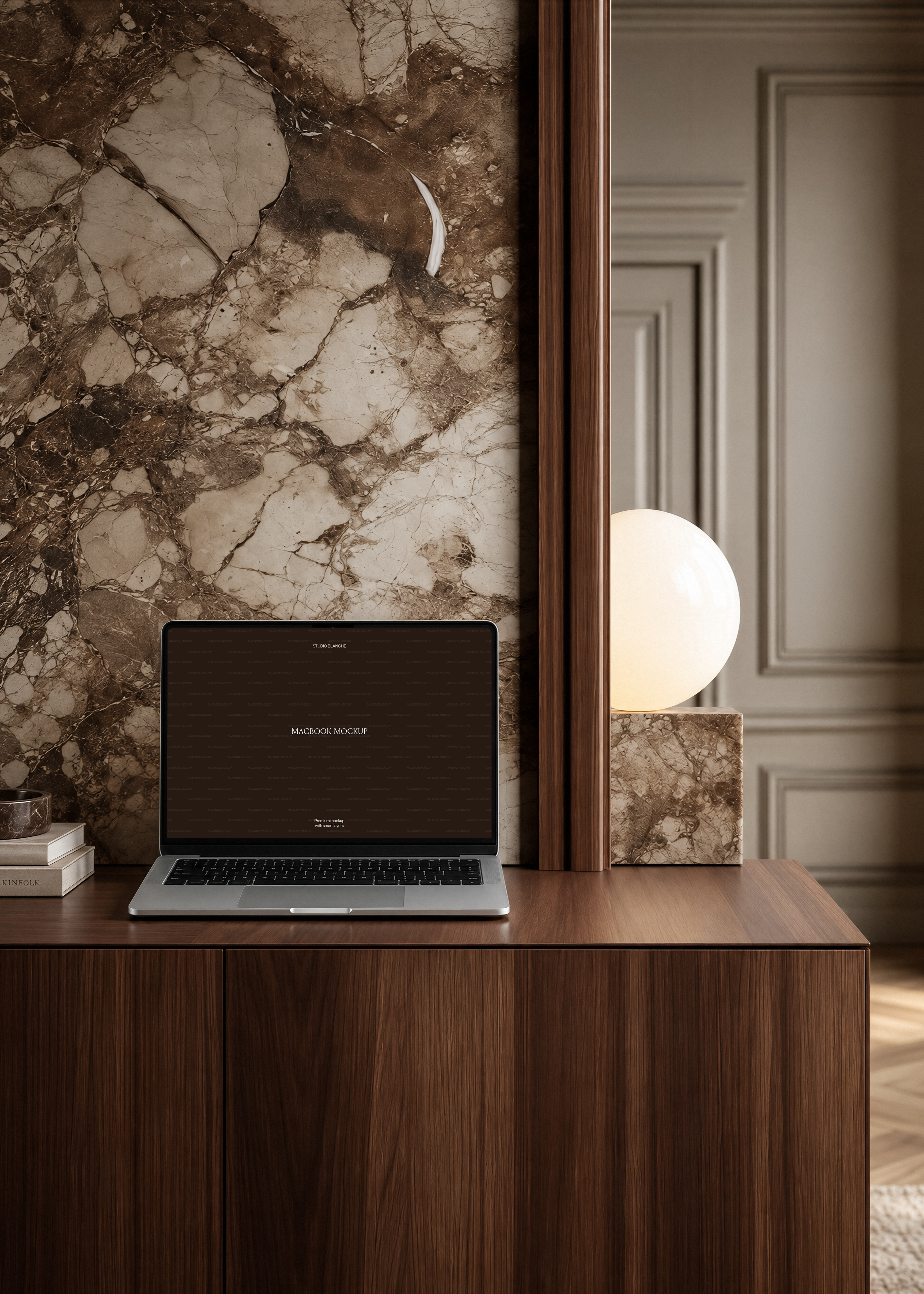 MacBook mockup on dark walnut desk, globe lamp on stone block, marble artwork panel and moulded wall panelling
