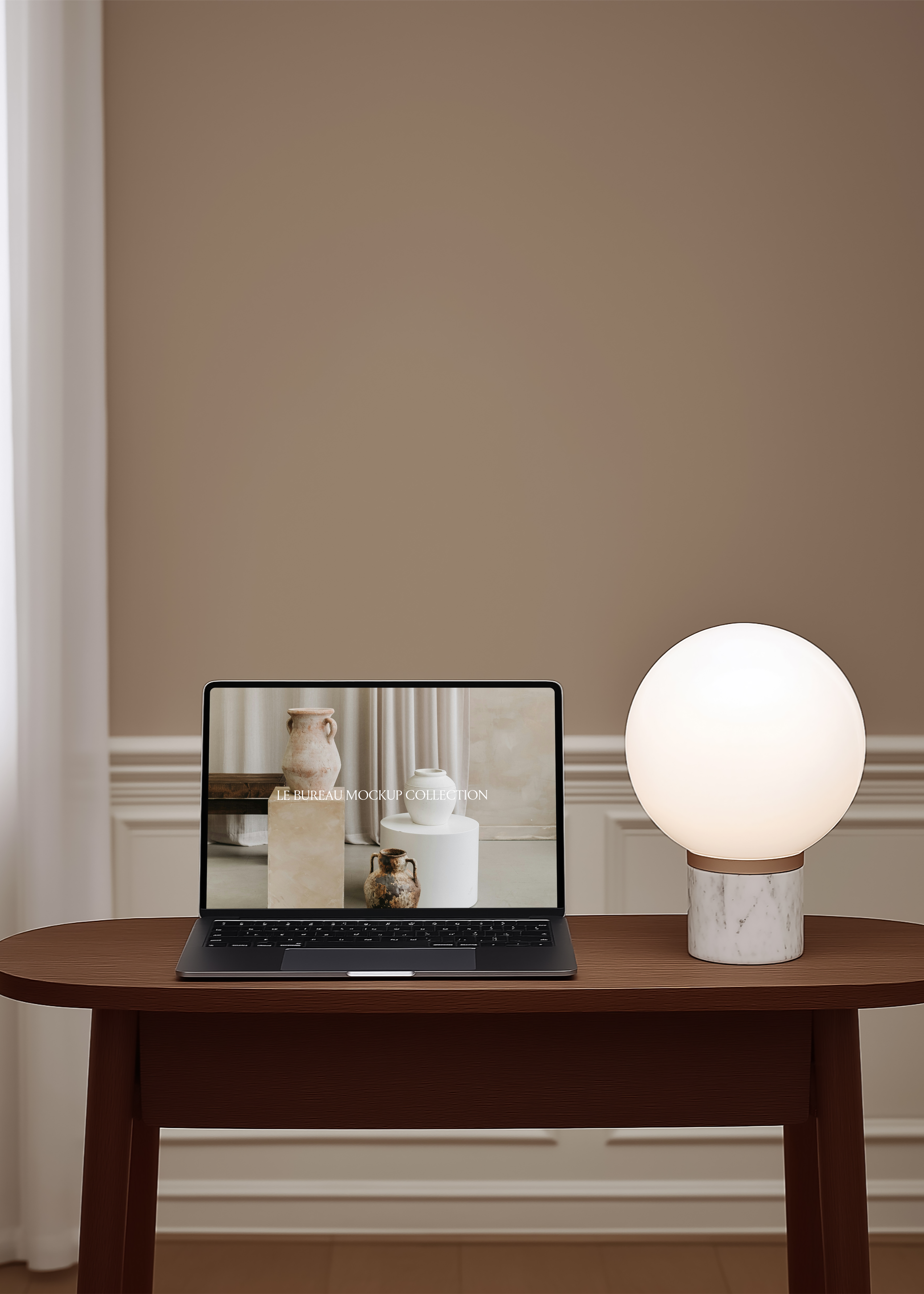 MacBook mockup displaying Le Bureau editorial on dark oval table, marble globe lamp and warm caramel dado panelling backdrop