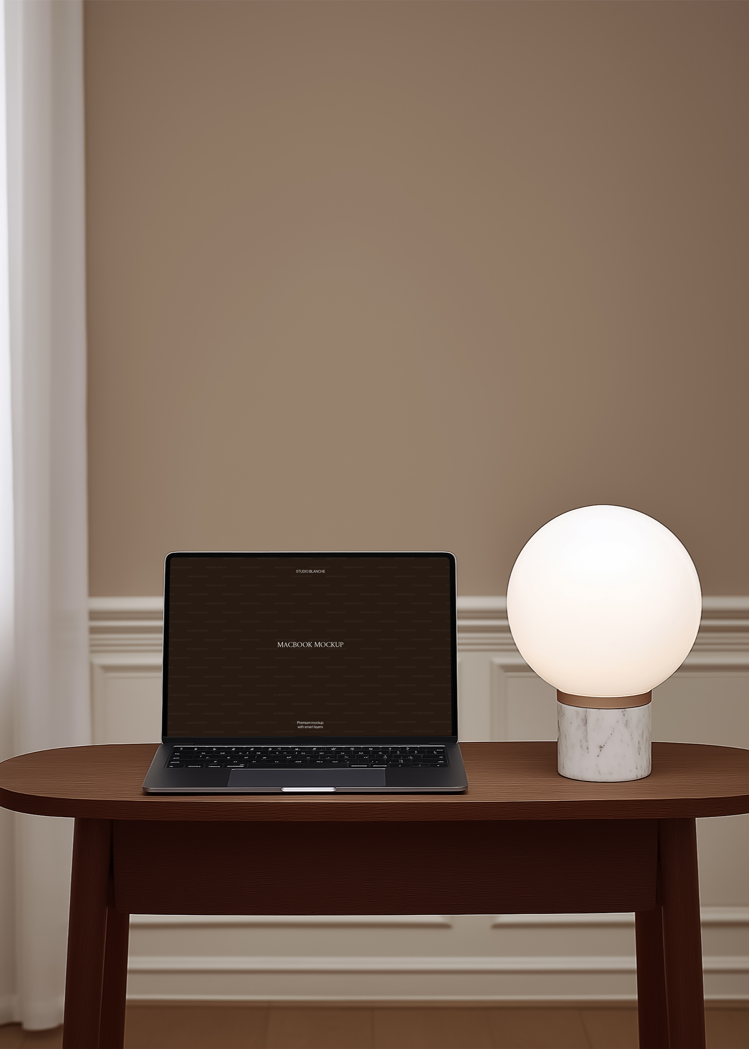 MacBook mockup open on dark oval side table beside white marble-base globe lamp, warm caramel wall and white dado panelling