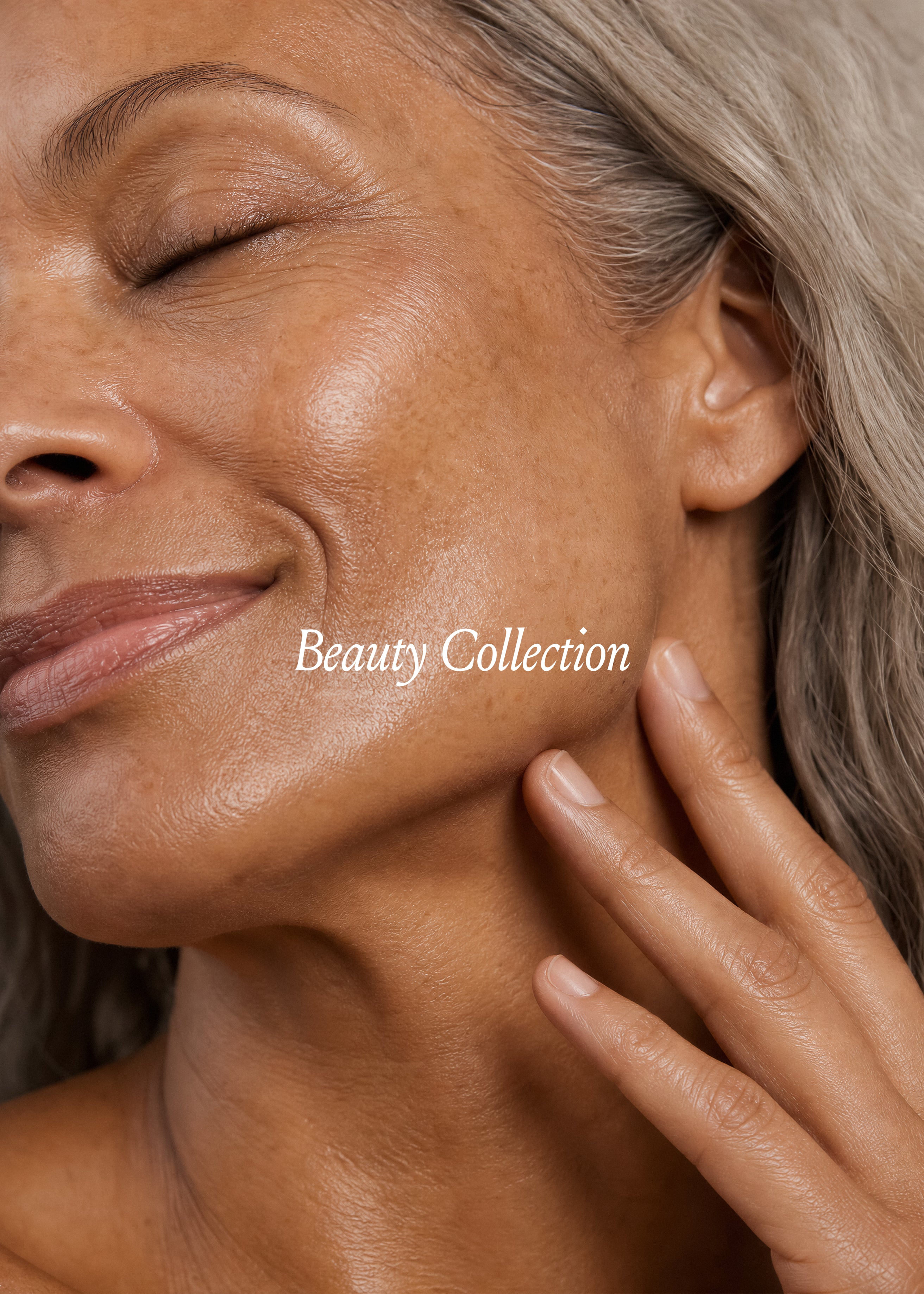 Extreme close-up of mature woman's face with eyes closed and hand on jaw, freckled skin, warm light, Beauty Vol. III