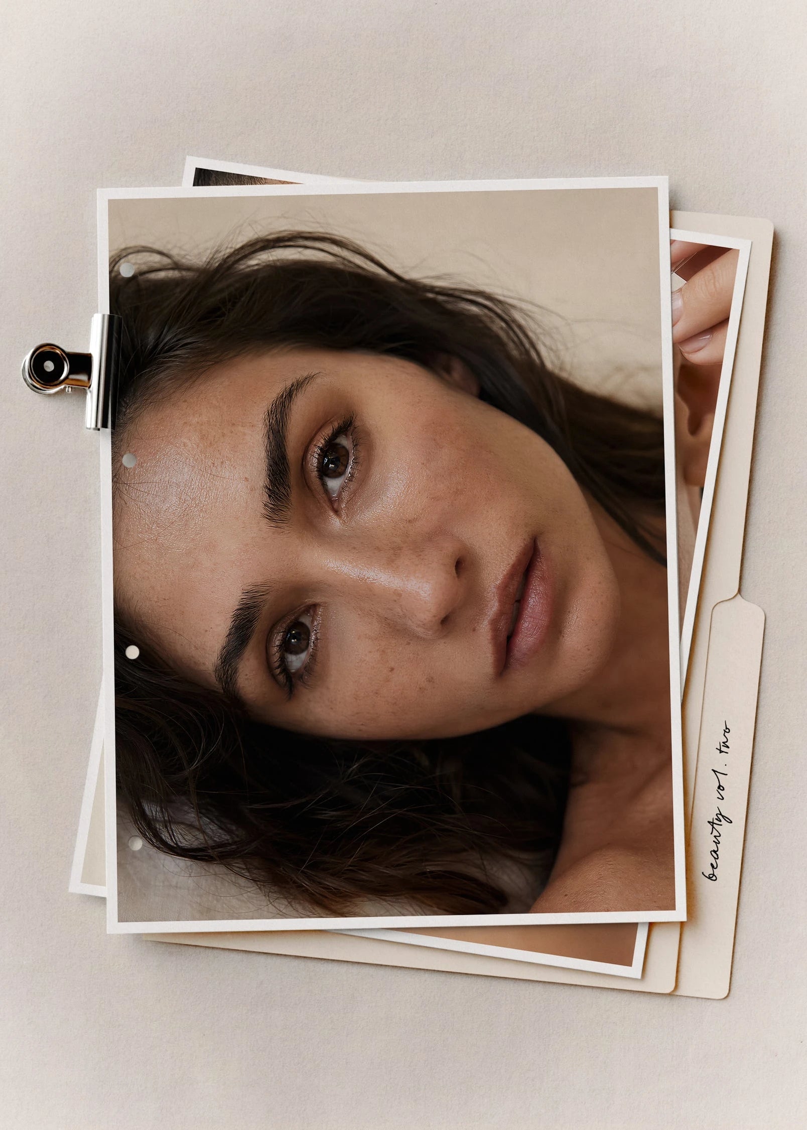 Editorial beauty stock photo of a woman with freckled skin on a warm neutral background, from Beauty Vol. II by Studio Blanche