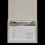 Notion client portal Final Deliverables page in a linen binder, showing a brand identity deliverables checklist with delivered and in progress statuses.