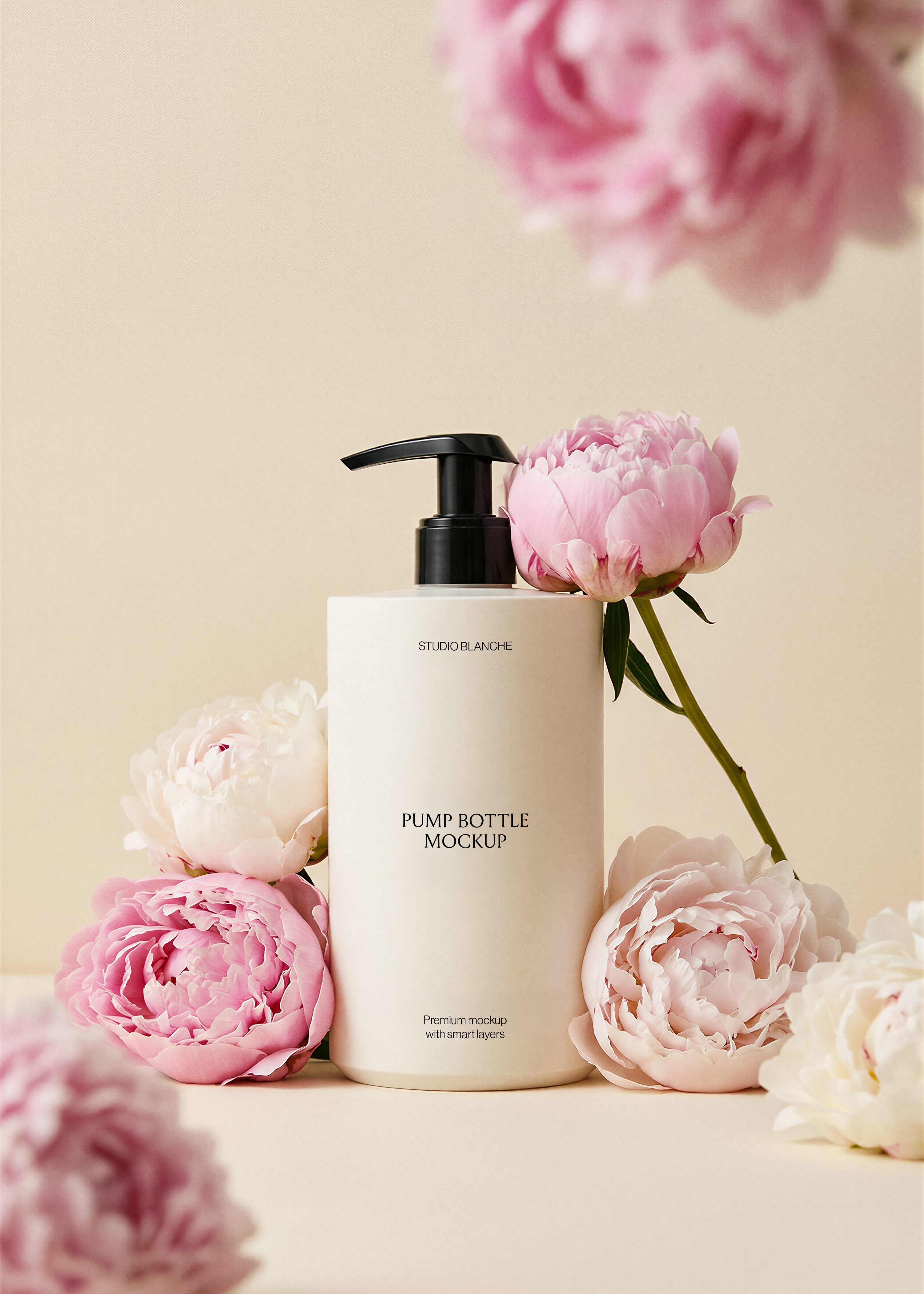 Pump bottle mockup with label area, pink and blush peonies surrounding base, blurred peony overhead, warm beige background