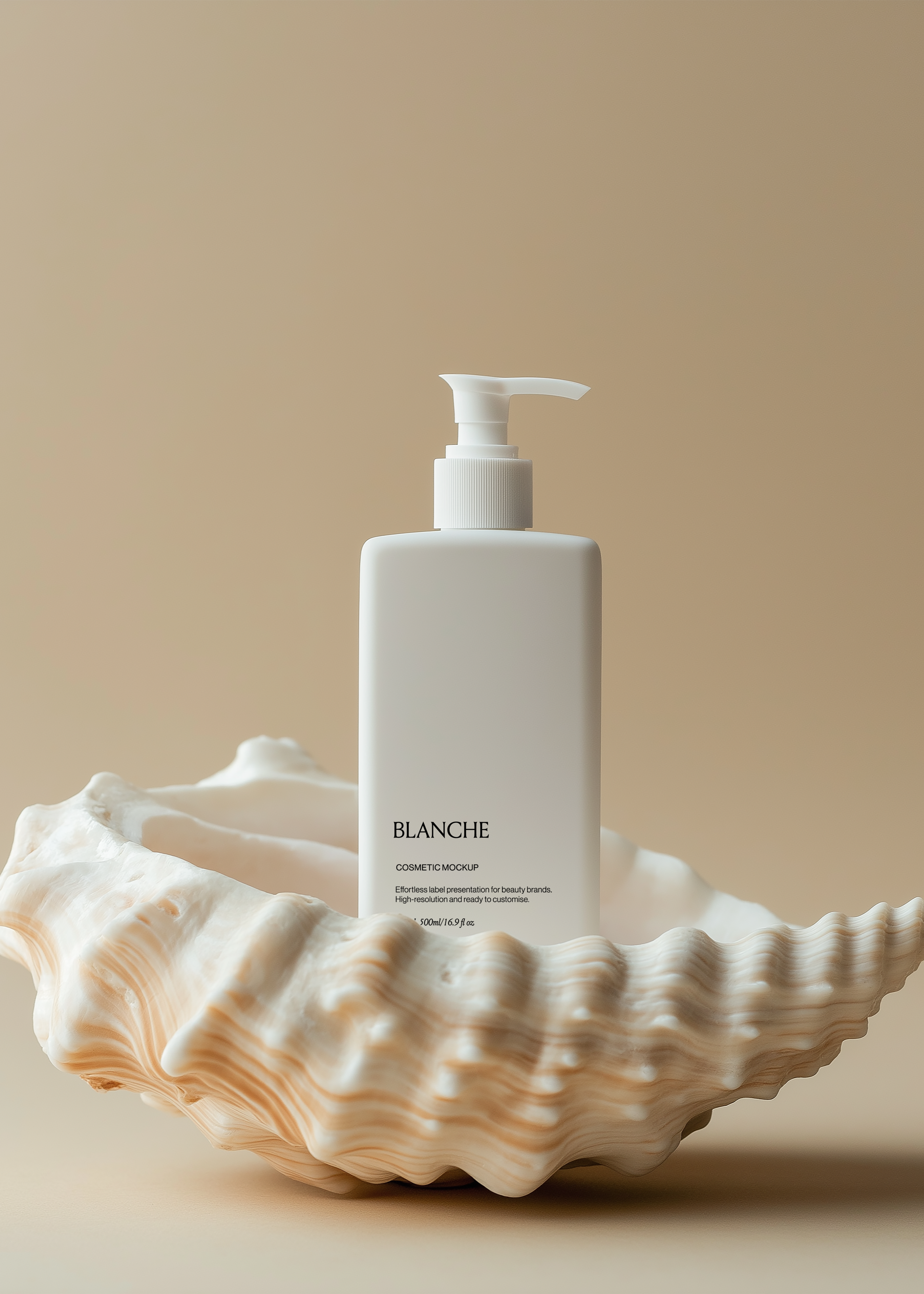 White matte cosmetic pump bottle mockup standing behind large conch shell on warm beige coastal backdrop