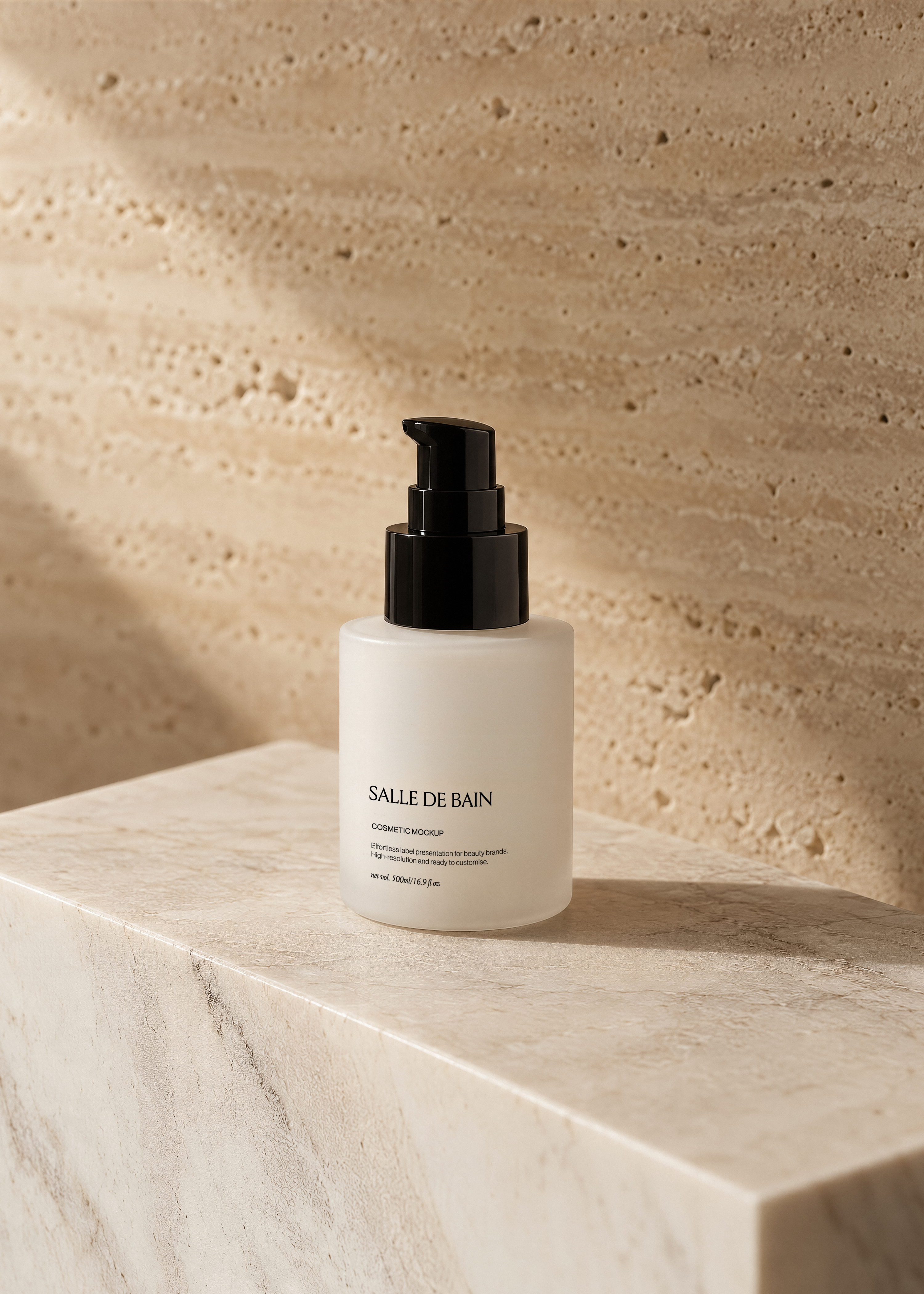 Frosted white pump bottle mockup with black pump on travertine plinth, warm stone wall and soft palm leaf shadow