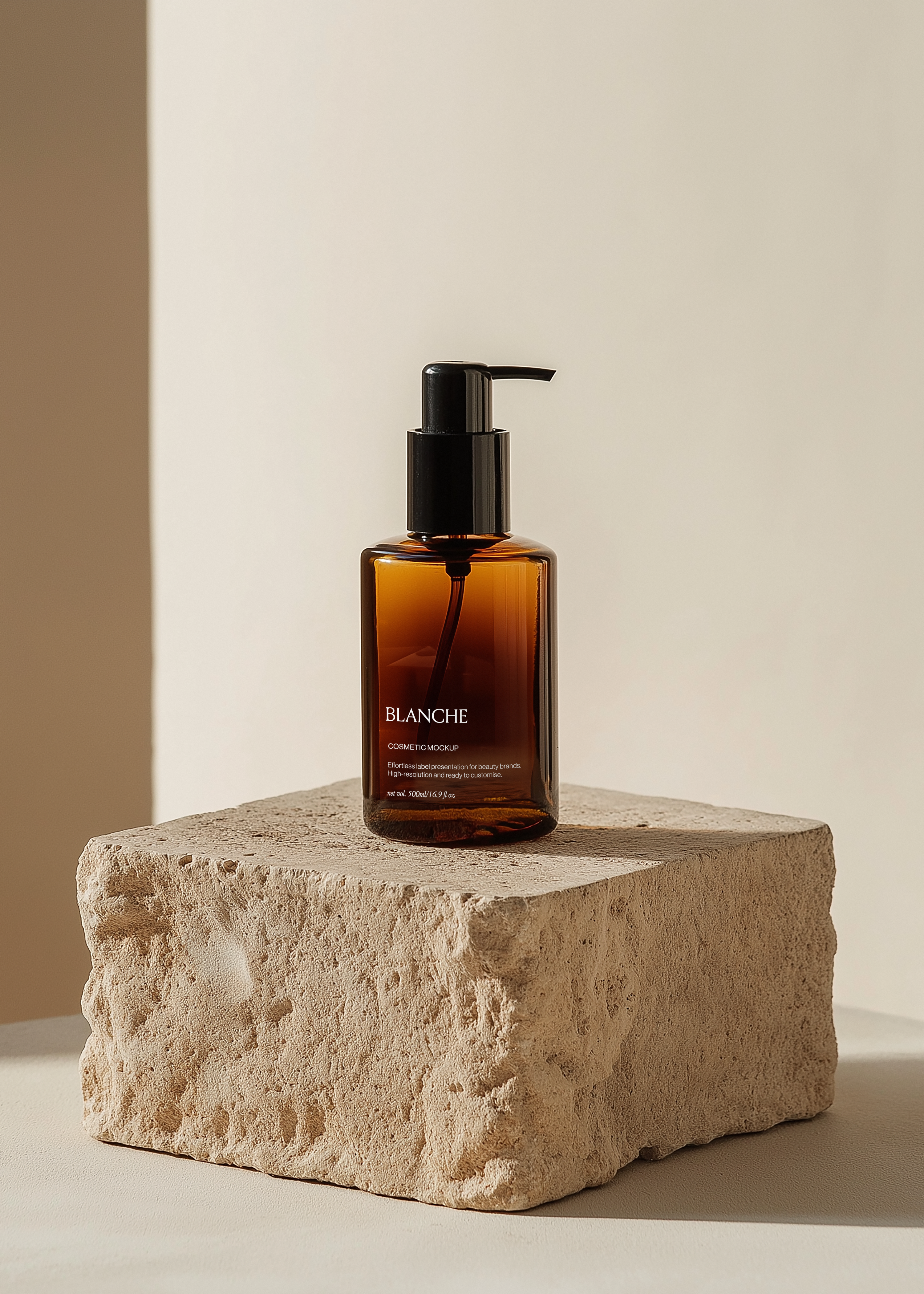 Amber cosmetic pump bottle mockup with black dispenser on rough limestone block in warm sunlight, editorial scene