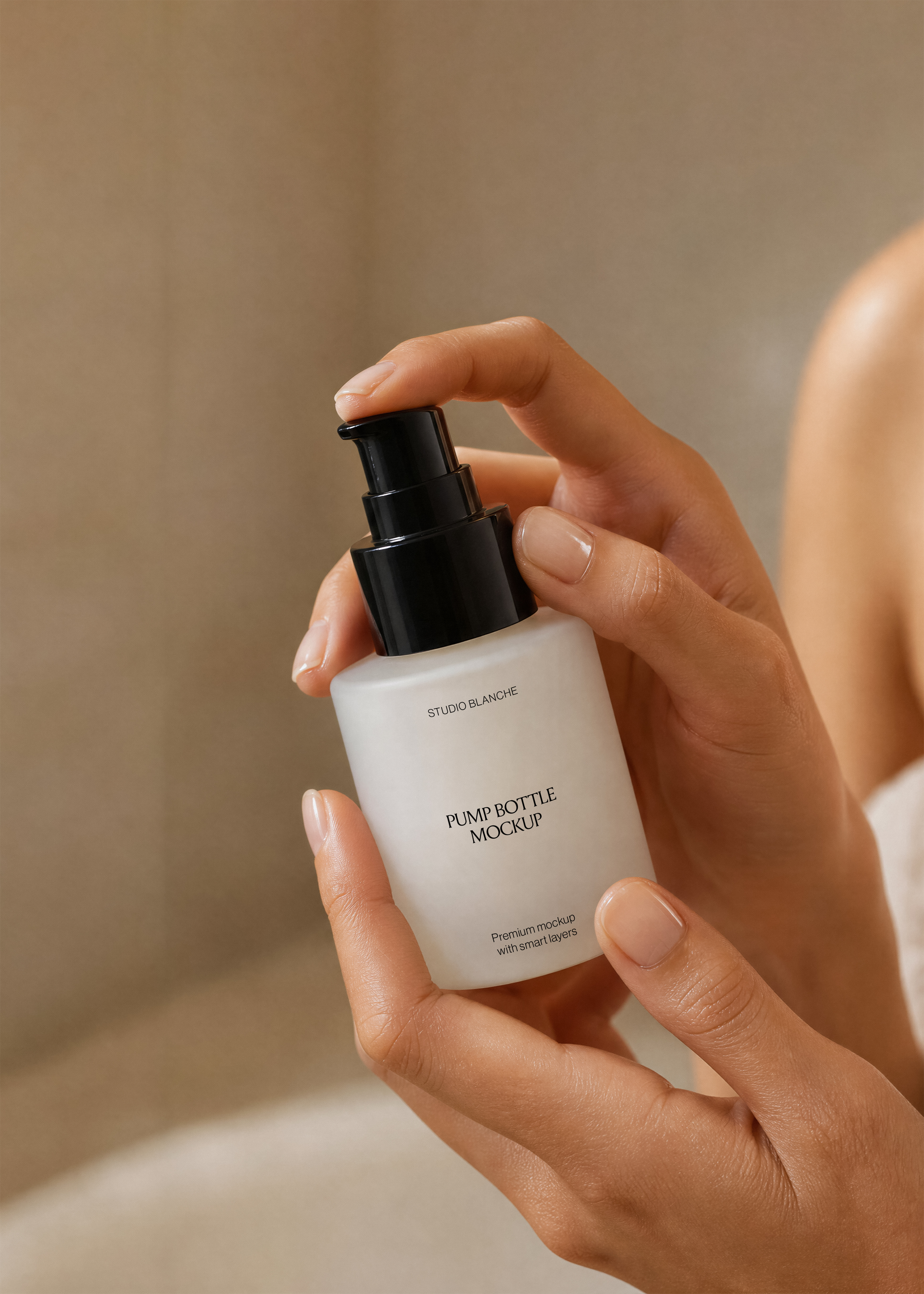 Close view of frosted glass cosmetic pump bottle with minimal black label typography, warm neutral lighting