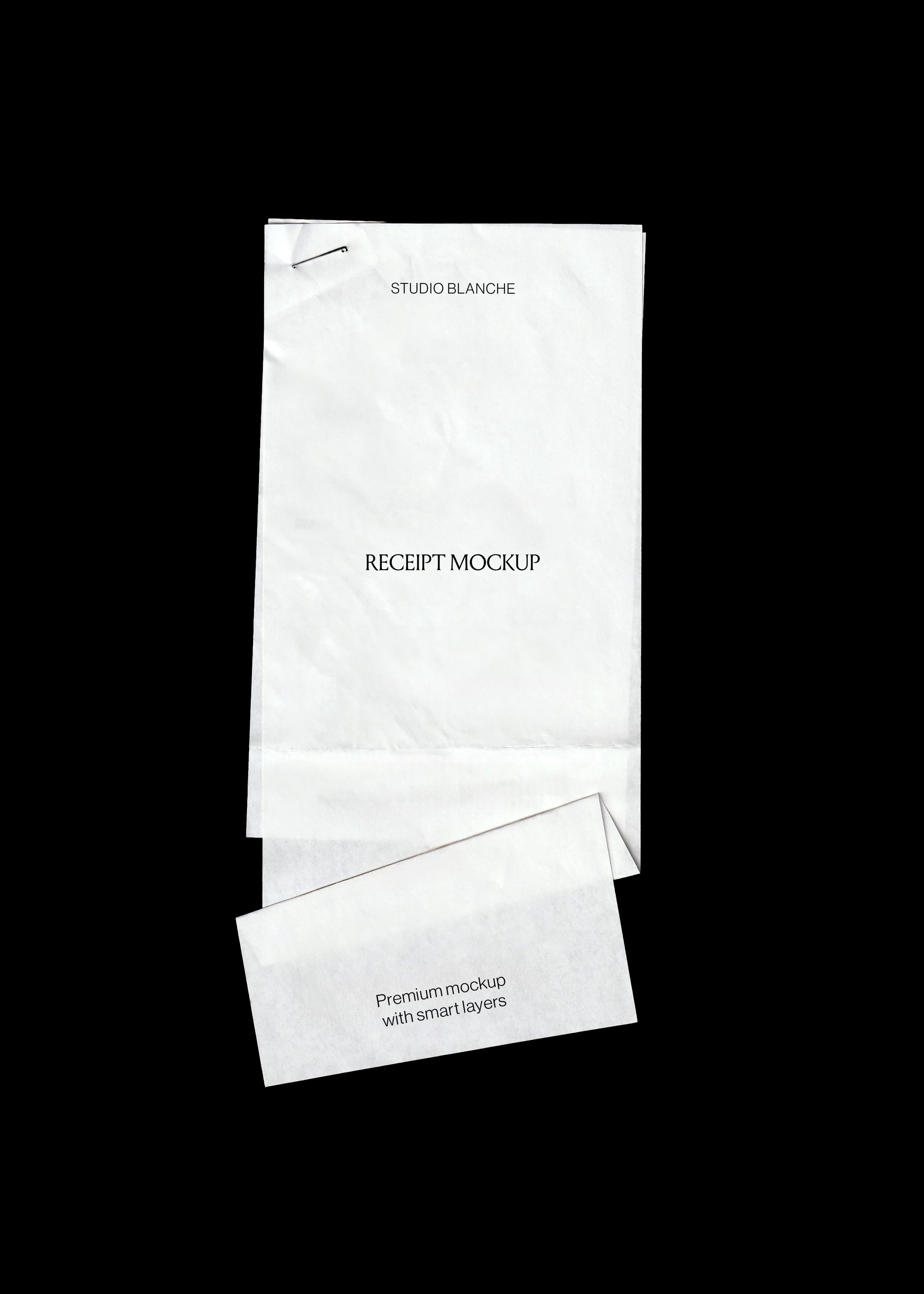 Blank creased receipt mockup scanned flat on black, long till roll with staple at the top and a folded slip