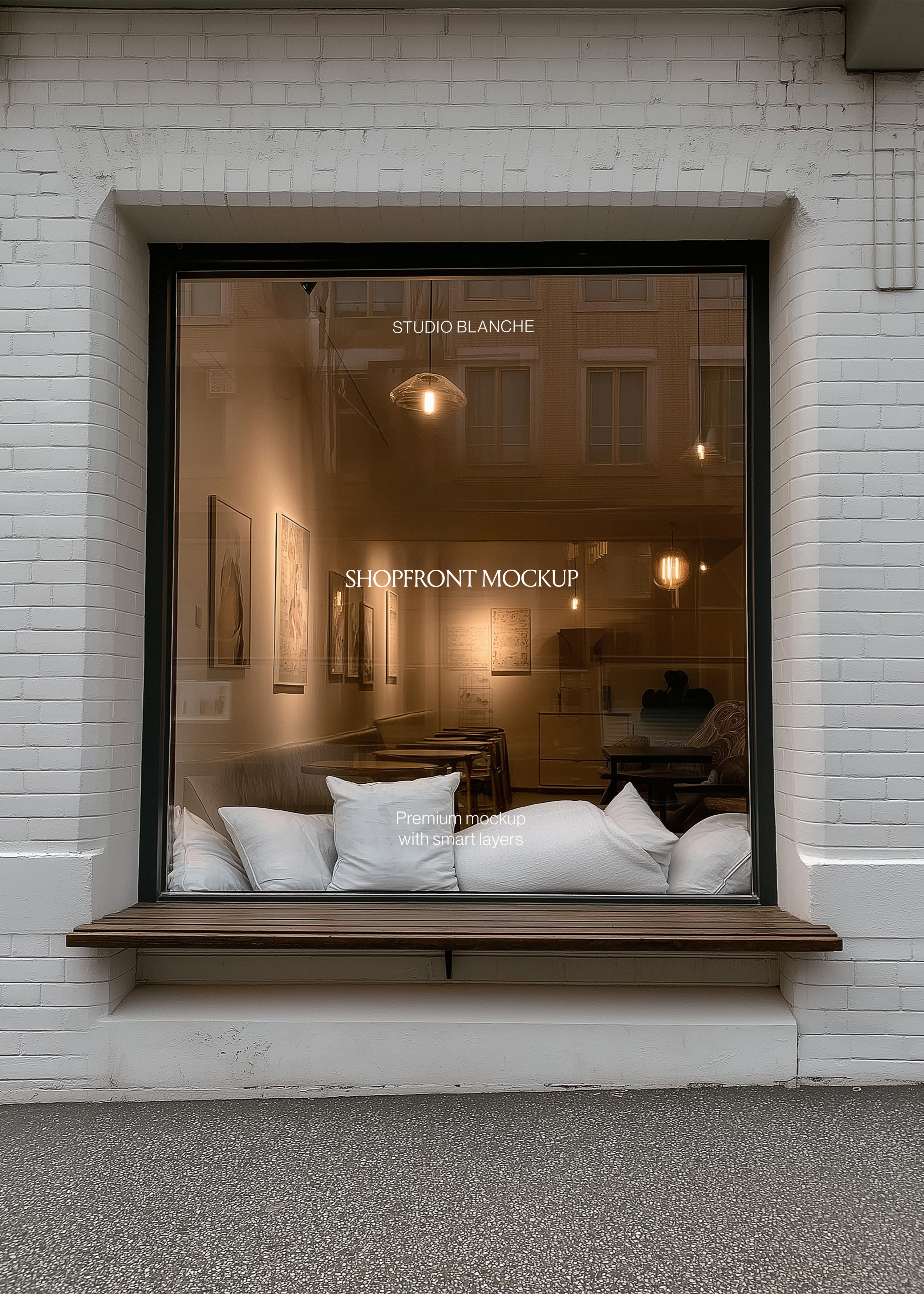 Shopfront window mockup detail, white vinyl café signage on glass, cushions on a window seat, pendant lights inside