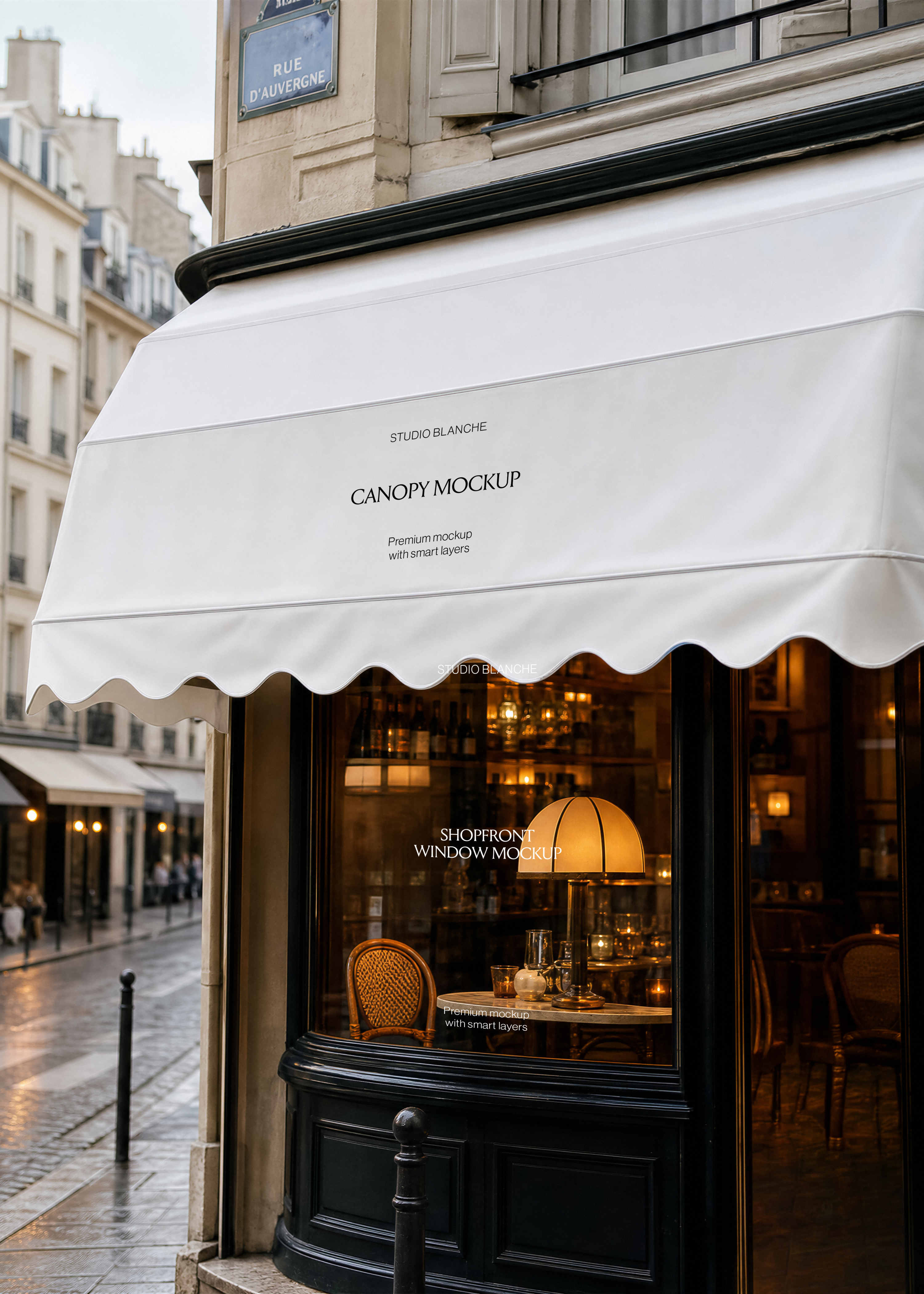 Café canopy mockup with white scalloped awning above lit shopfront window, rattan chair and table lamp inside, street sign