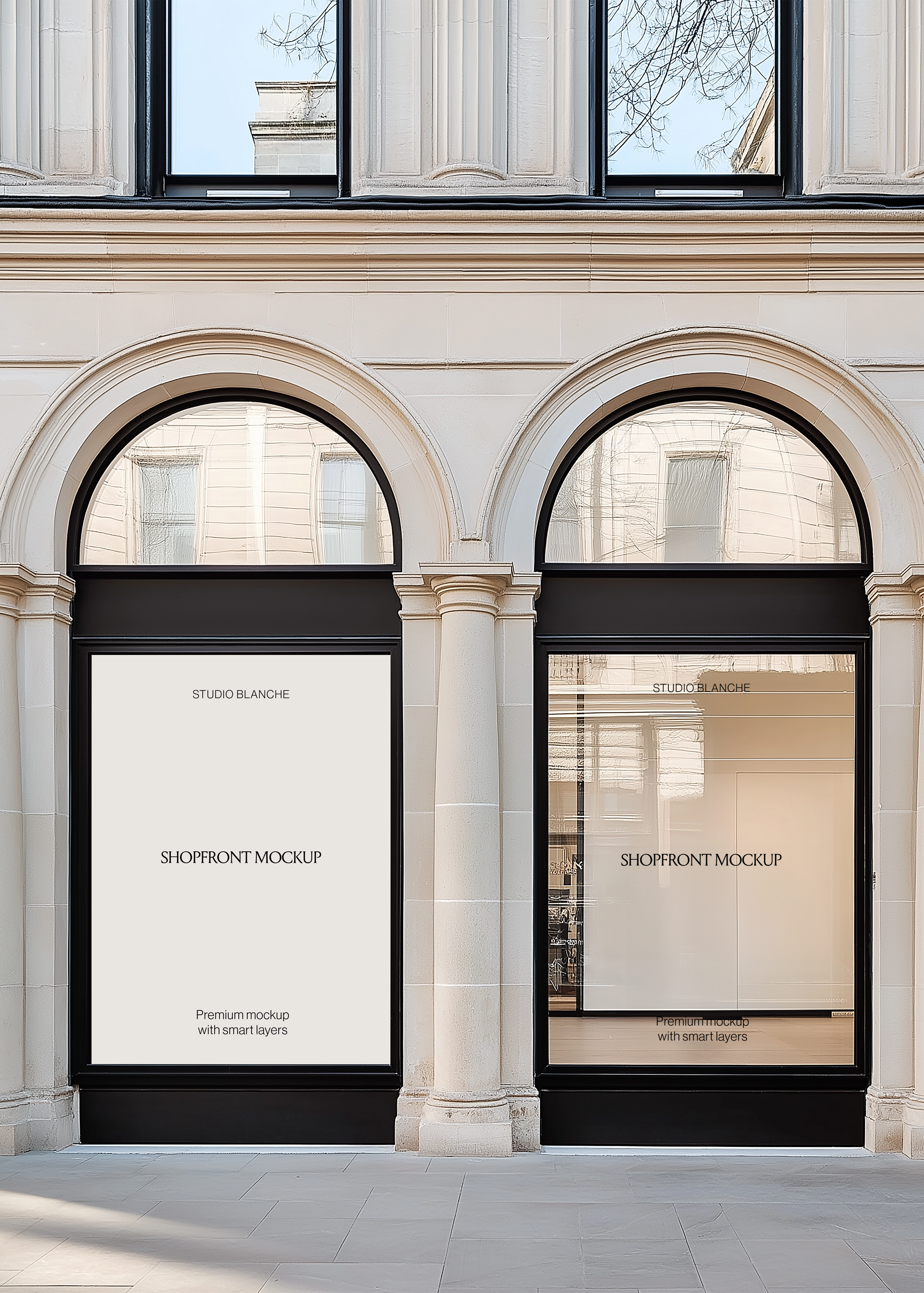 Retail window display mockup on a classic sandstone facade with black frames, columns and grey stone paving underfoot