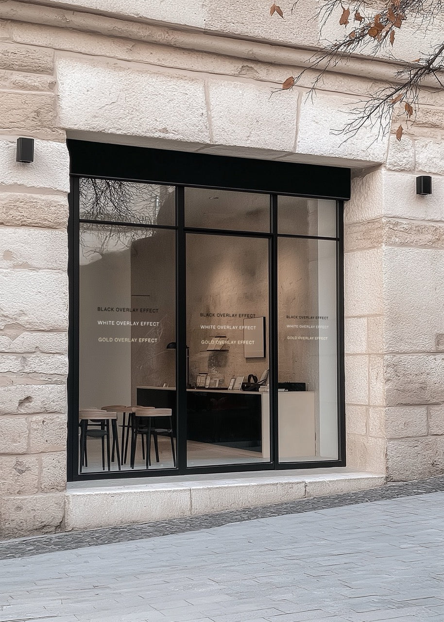 Modern store front mockup with large glass windows on a stone building.