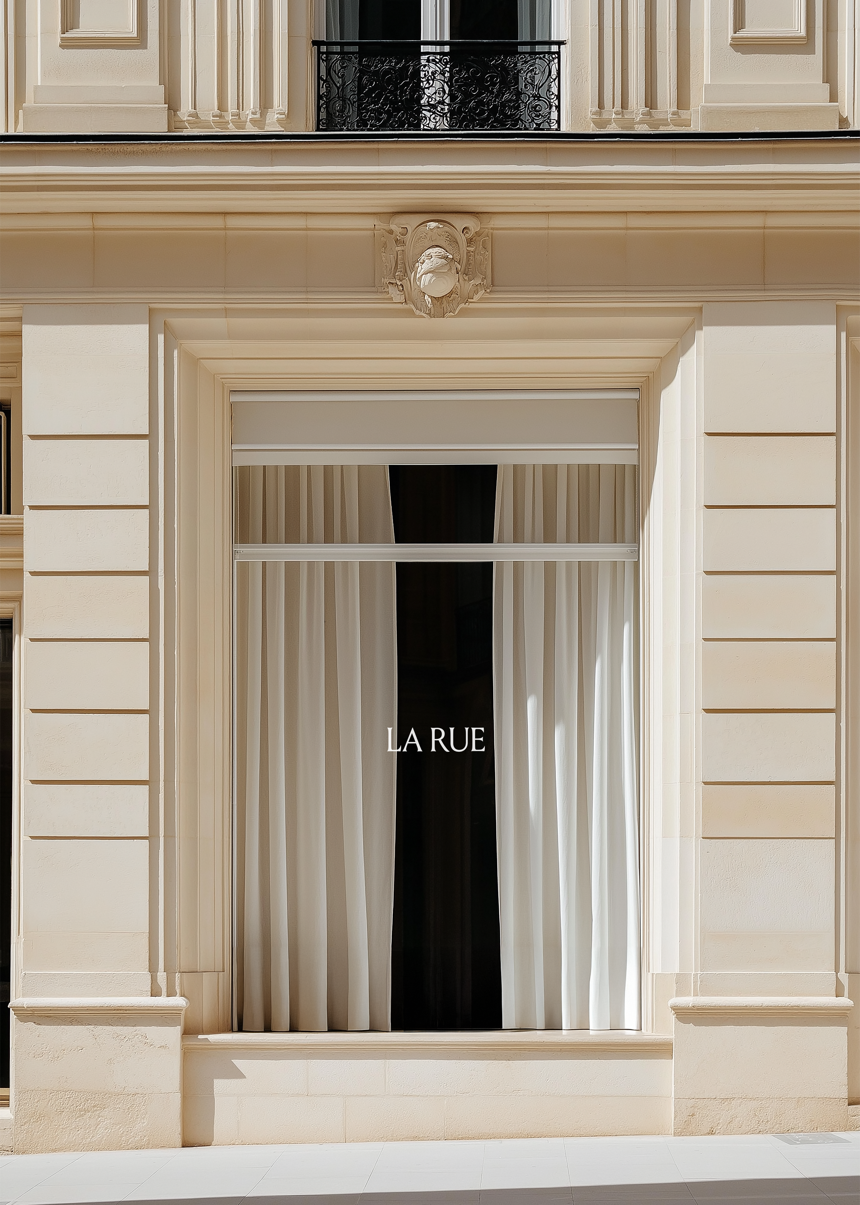 Shopfront mockup of a sunlit sandstone window with LA RUE signage, sheer draped curtains and carved stone cartouche