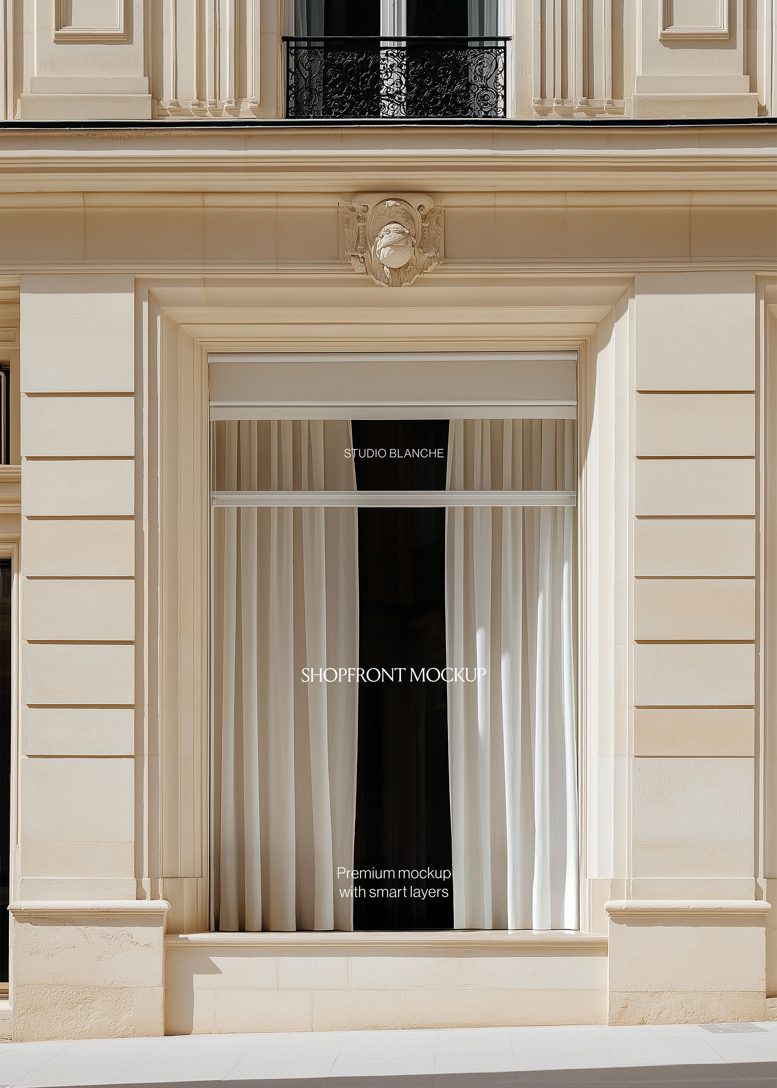 Parisian window storefront mockup with warm cream limestone facade, wrought iron balcony above and stone sill