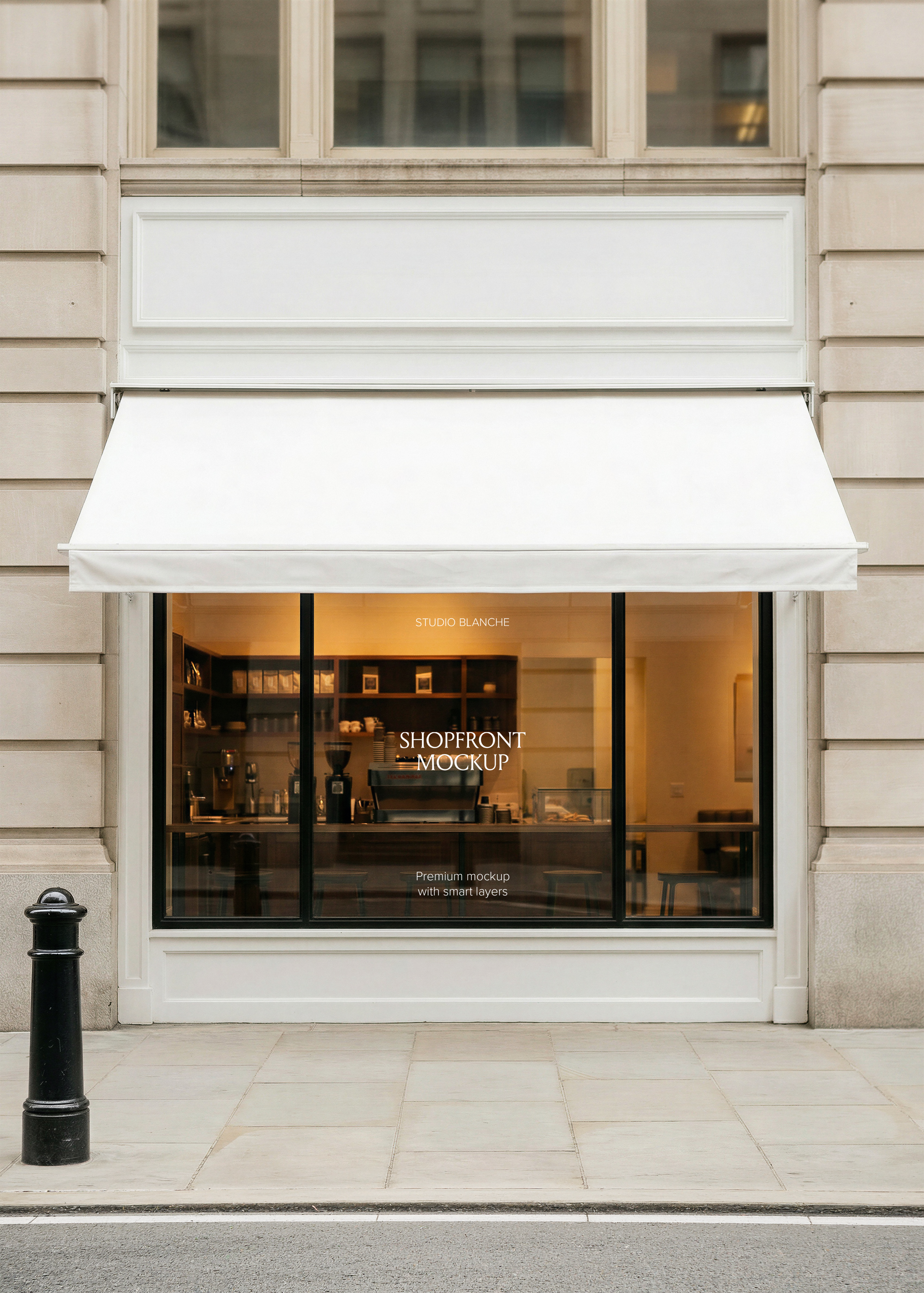 Shopfront canopy mockup showing white awning and window graphics on Parisian-style cafe facade with warm interior glow