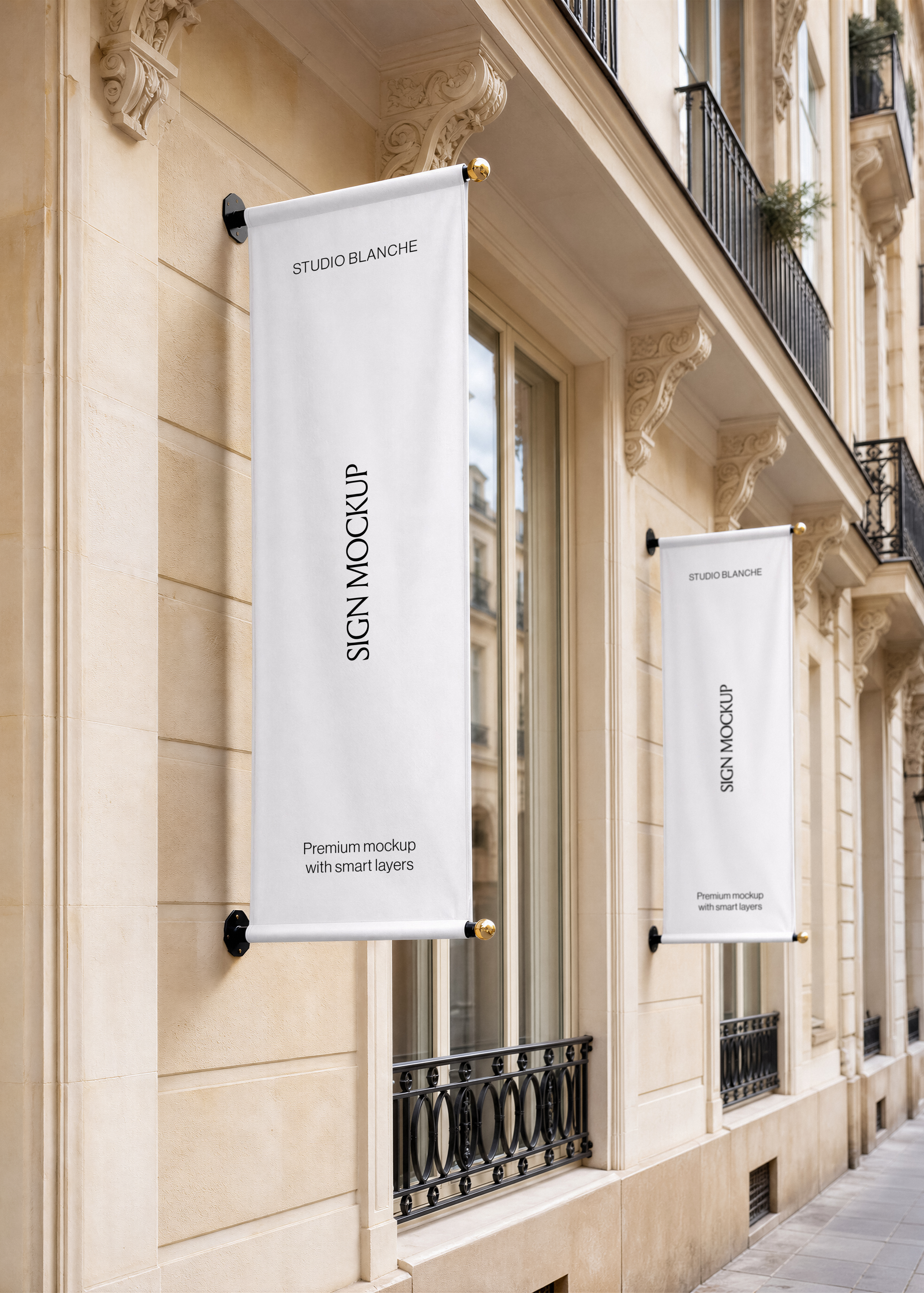 Blank banner sign mockup on black wall brackets with brass finials, carved stone facade and tall windows