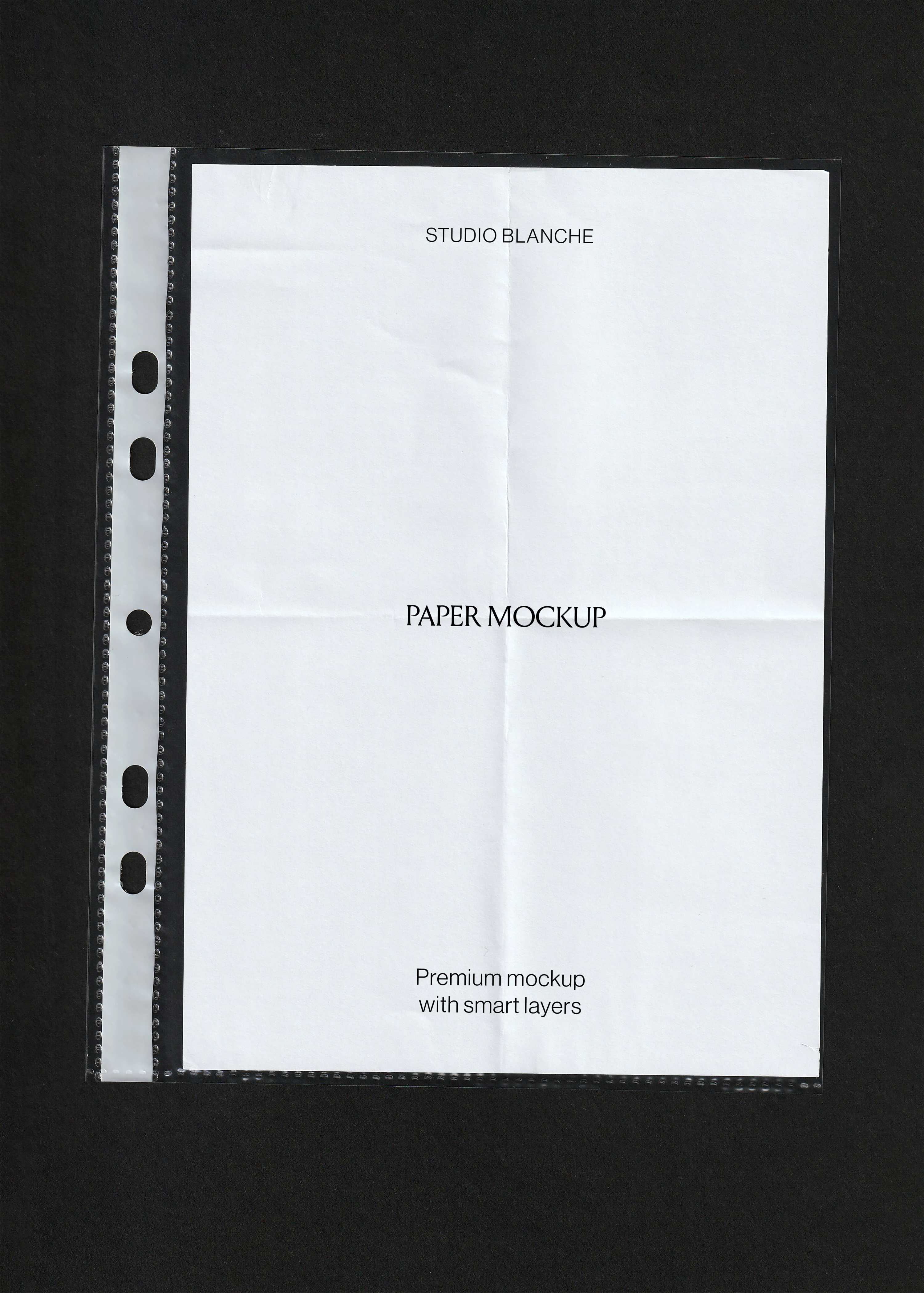 Scanned paper mockup, blank creased white A4 sheet inside a clear punched pocket on black background